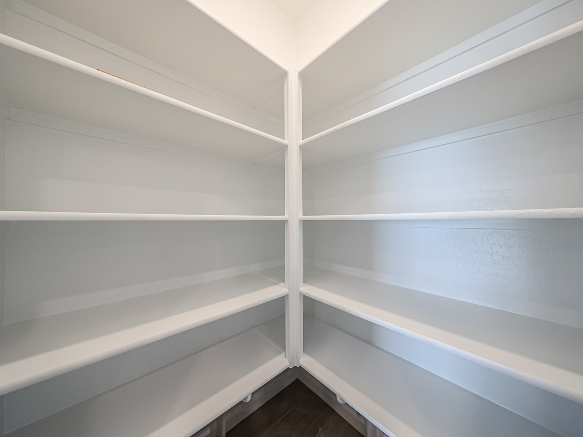 A white wall with white railings.