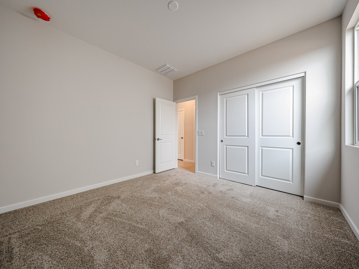 A hallway with white doors.