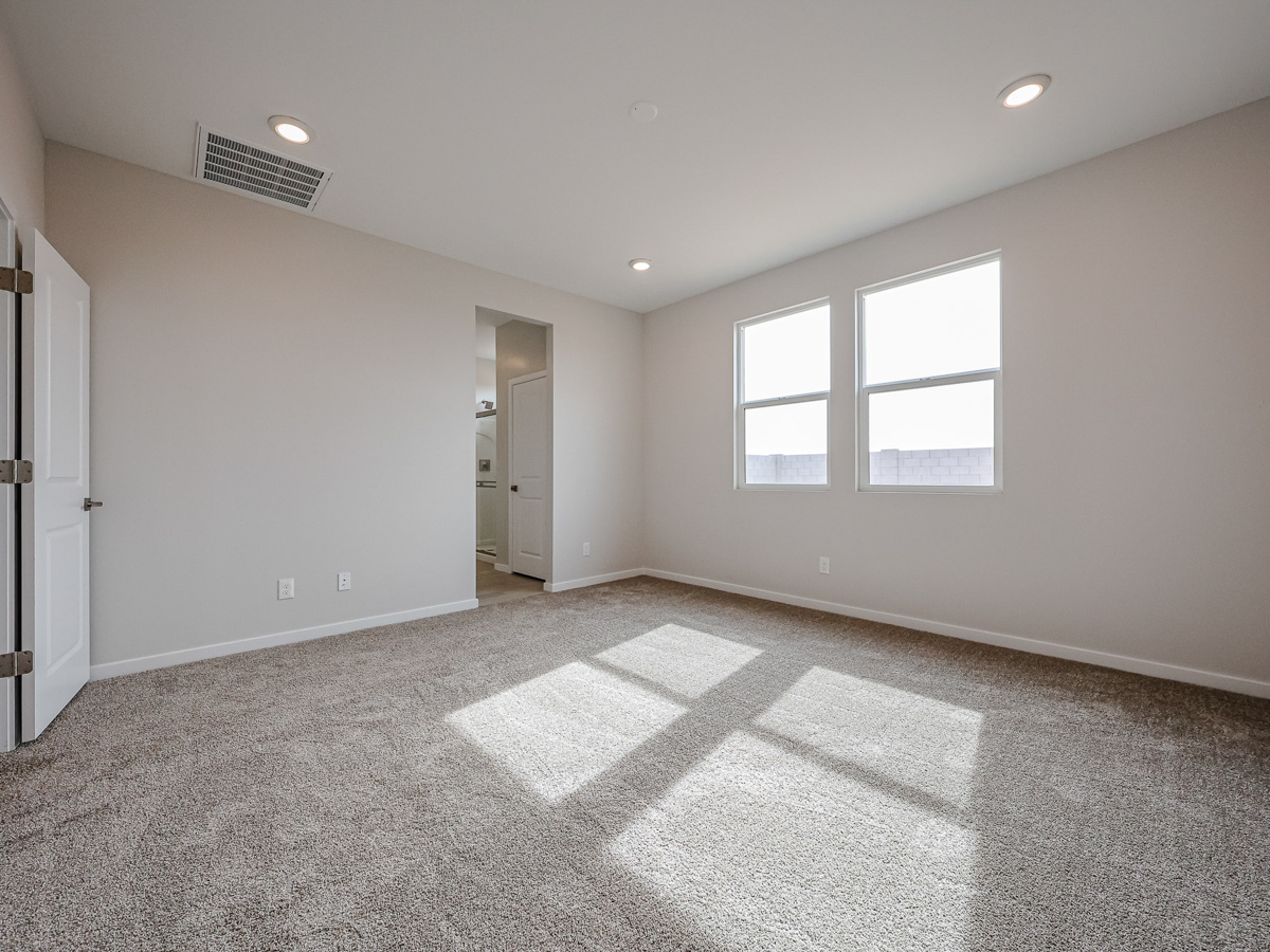 A room with a tile floor and windows.