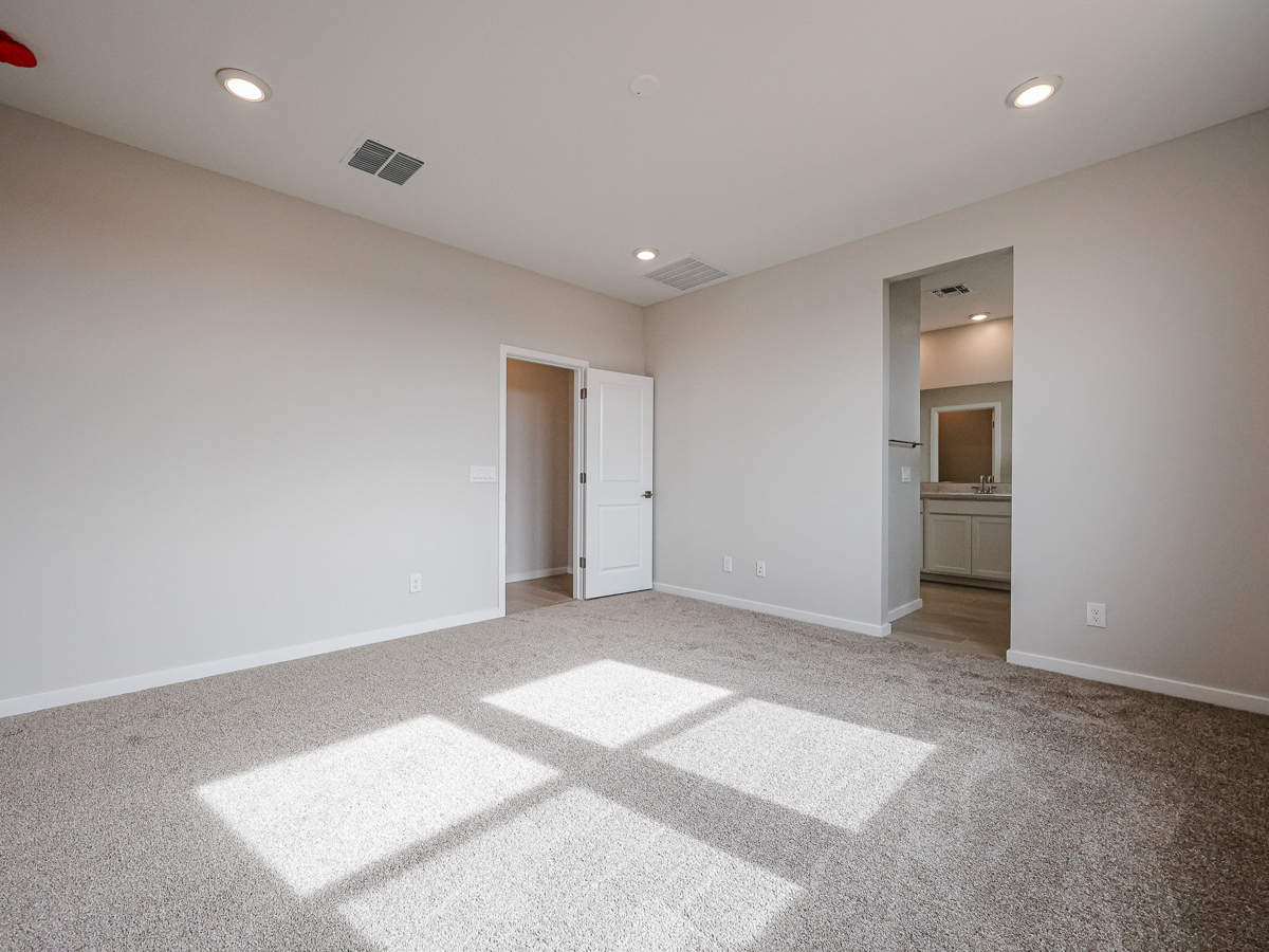 A room with white walls and a tile floor.
