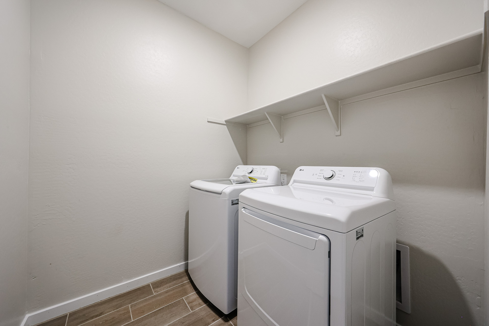 A washing machine in a room.