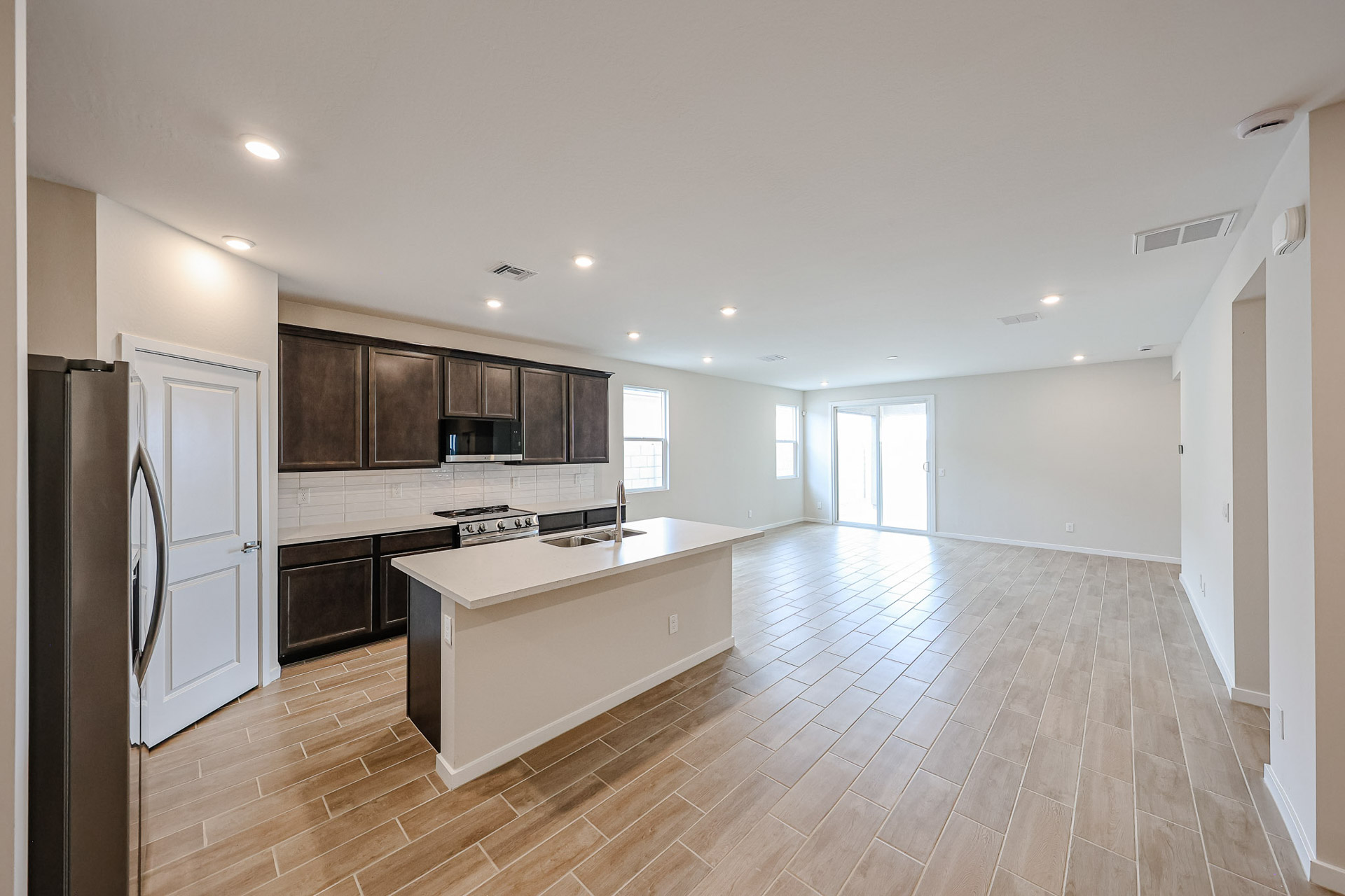A kitchen with wooden floors.