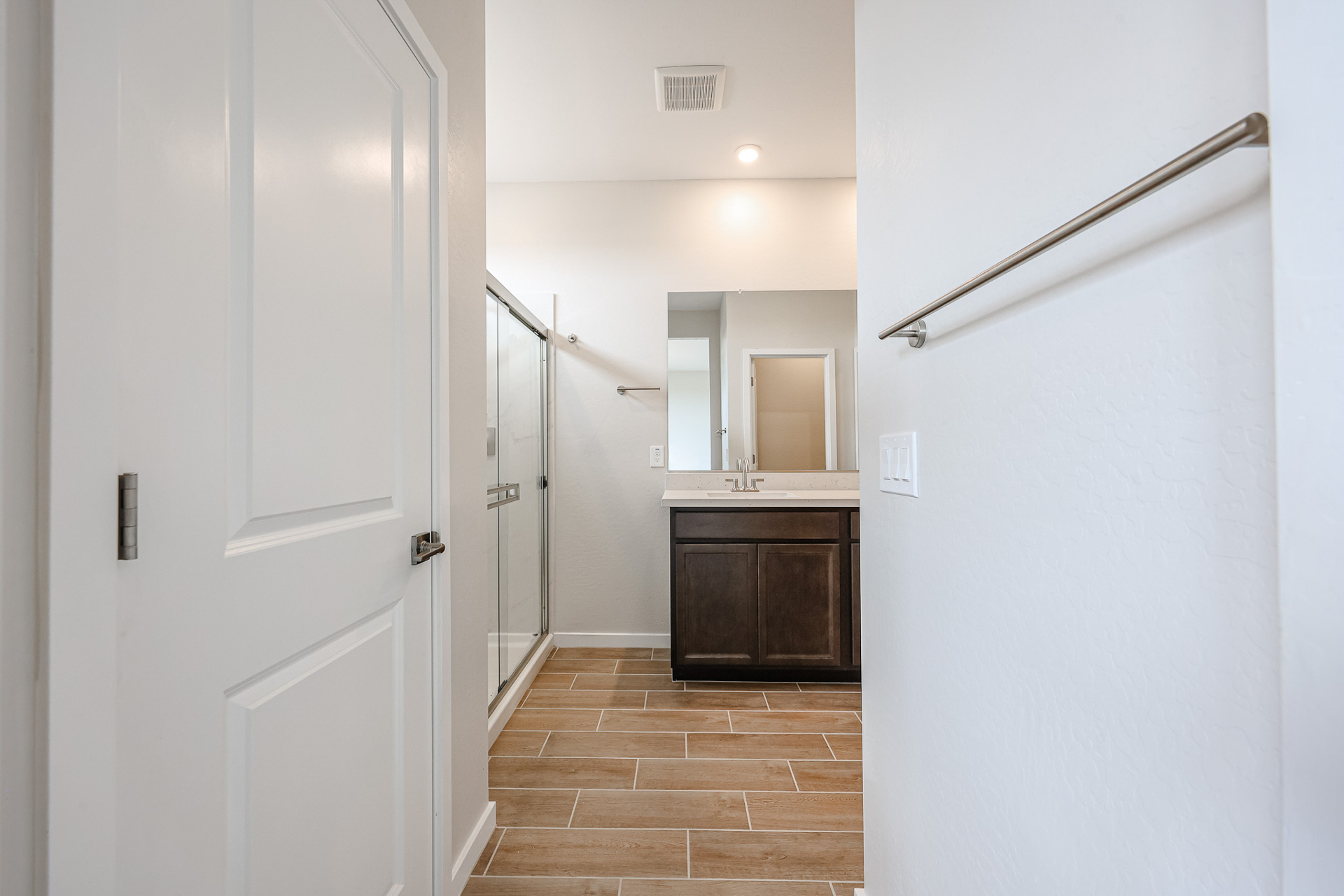 A bathroom with white walls.