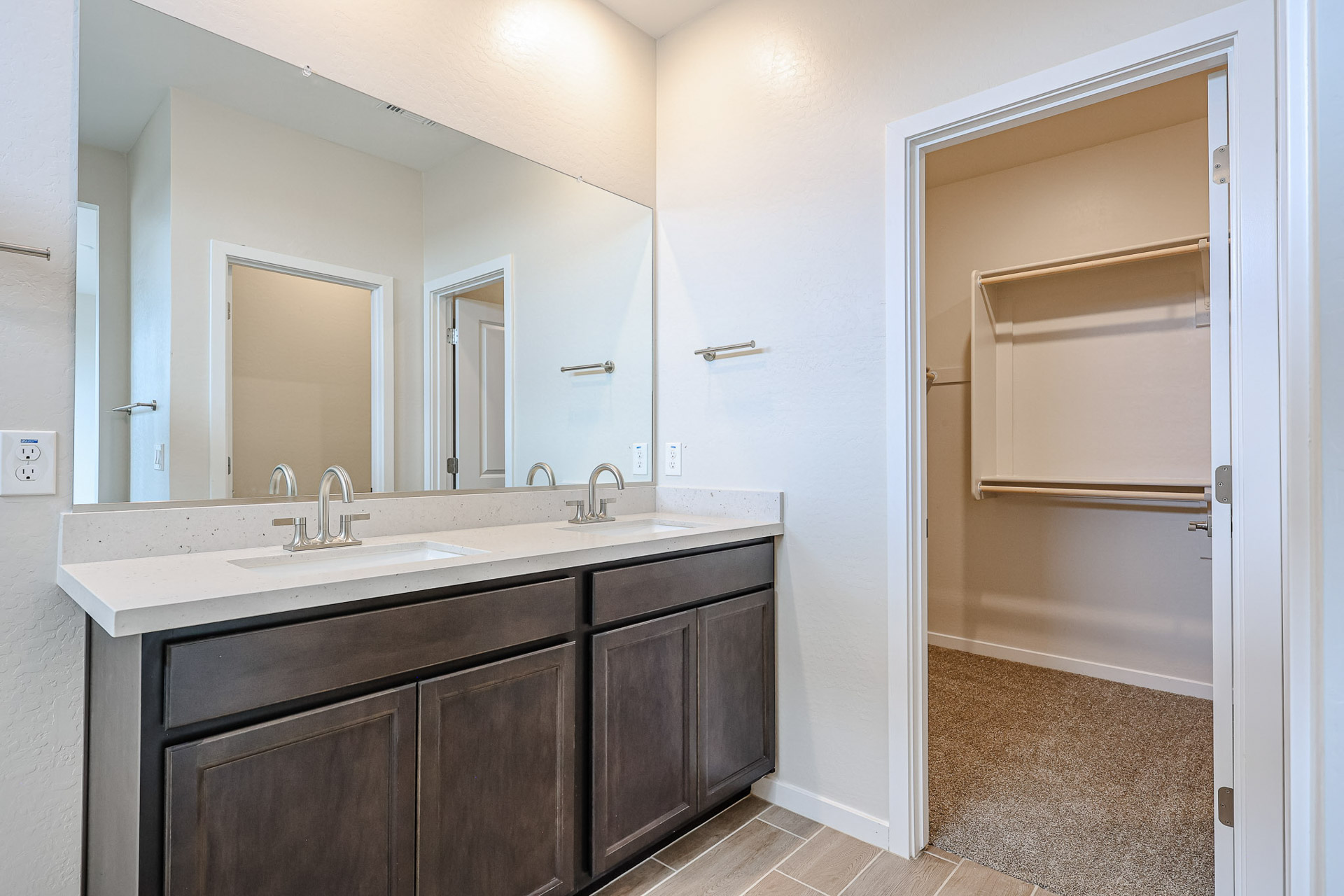 A bathroom with a sink and a shower.