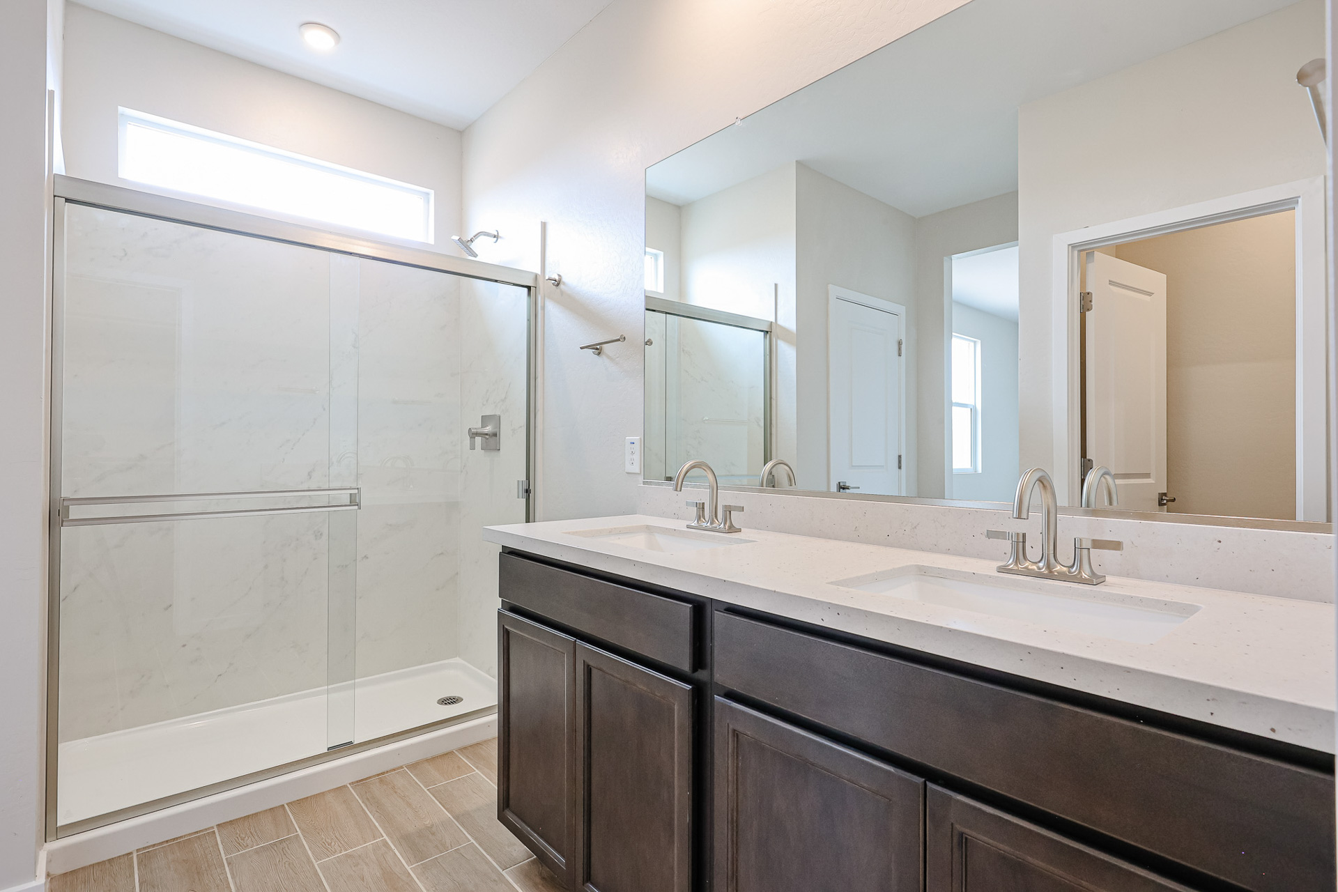 A bathroom with a glass shower.