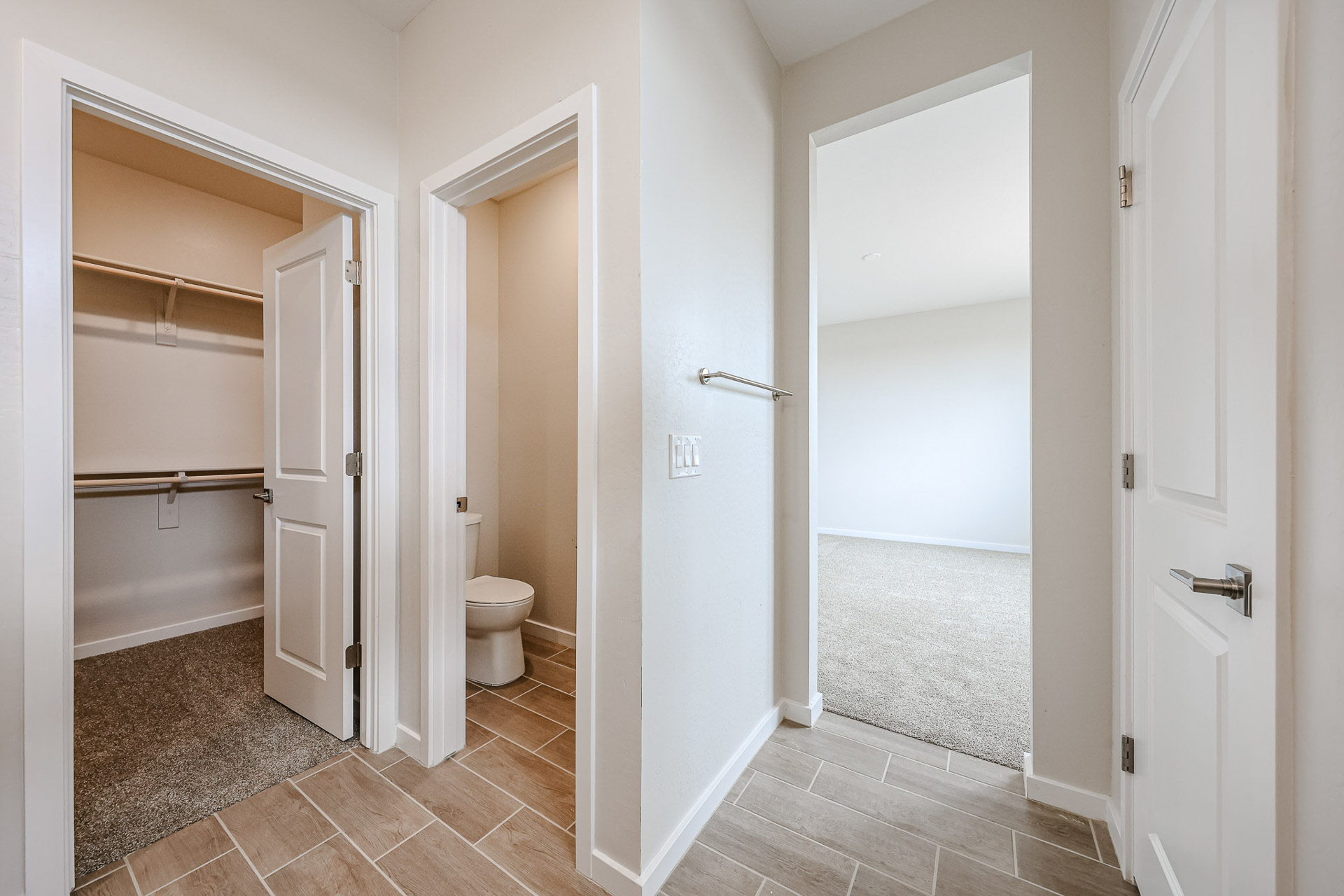 A bathroom with a toilet and shower.