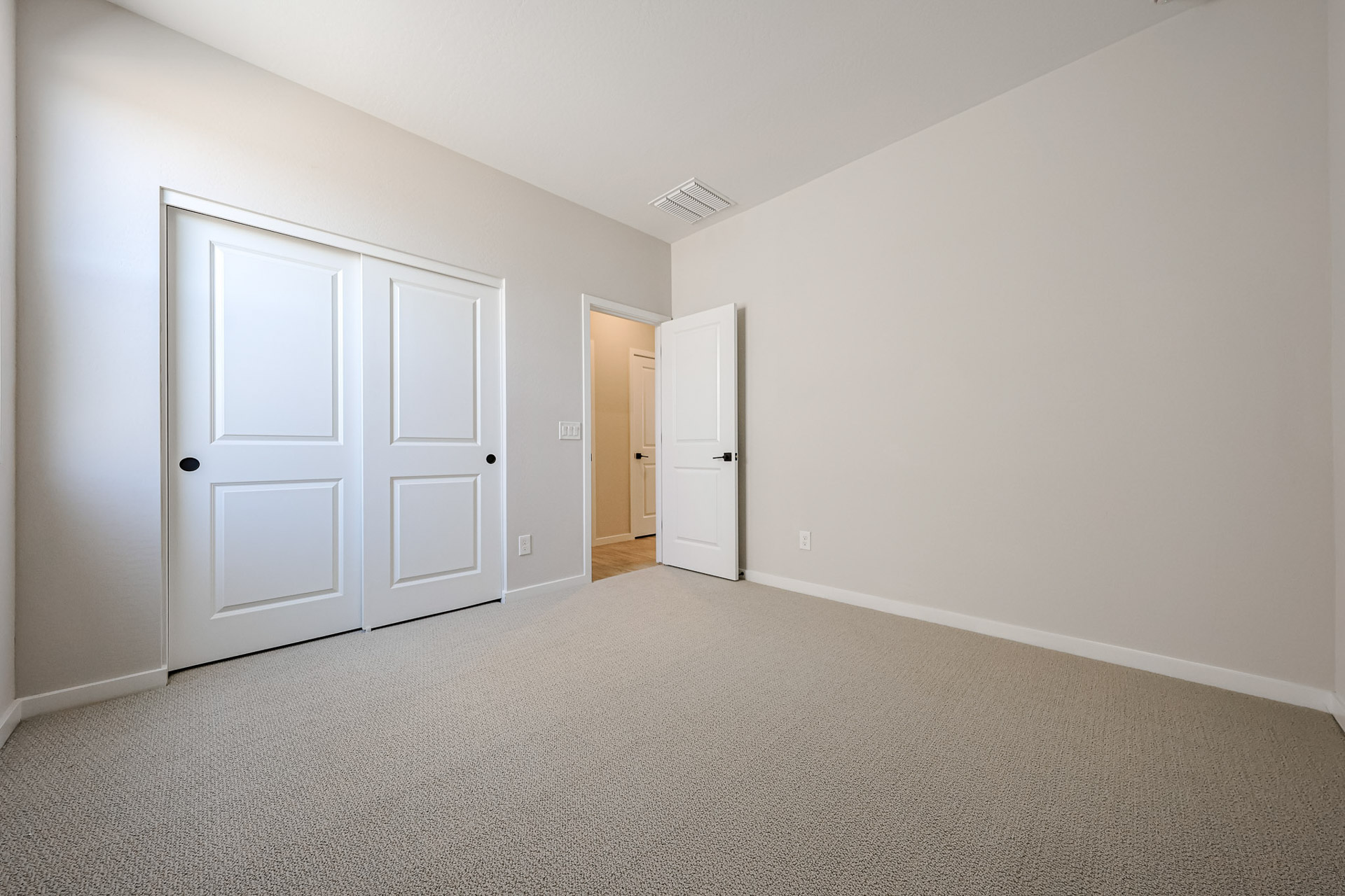 A room with white doors.