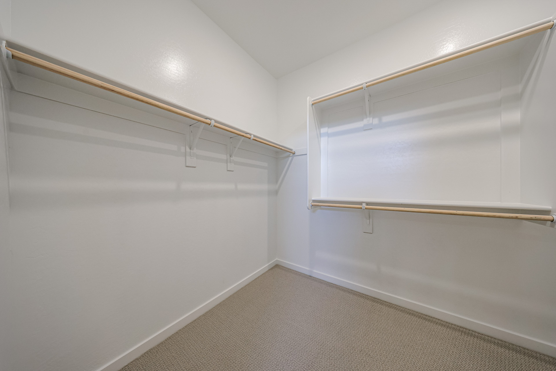 A white wall with a white door.