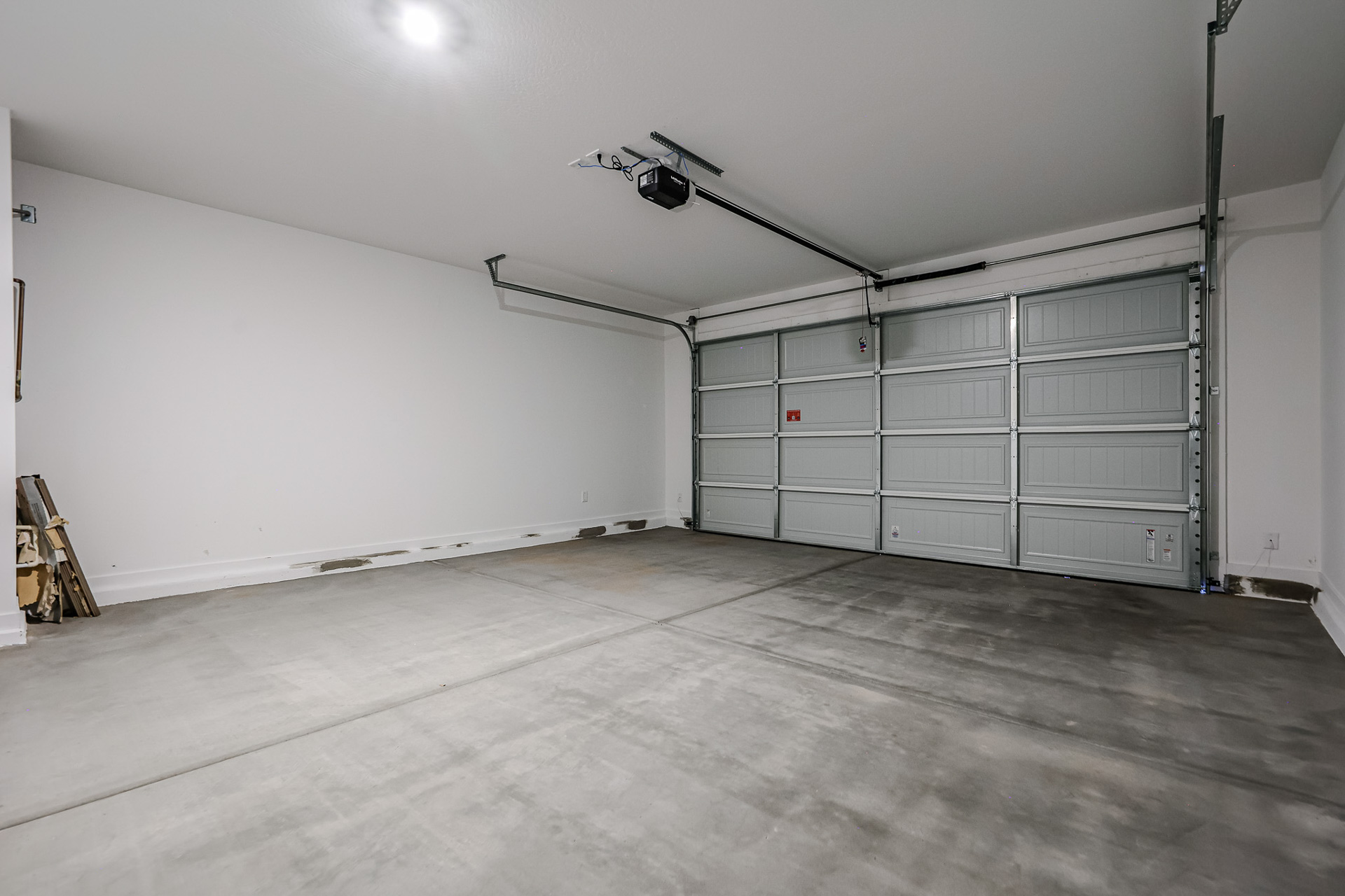 A room with a large metal door.
