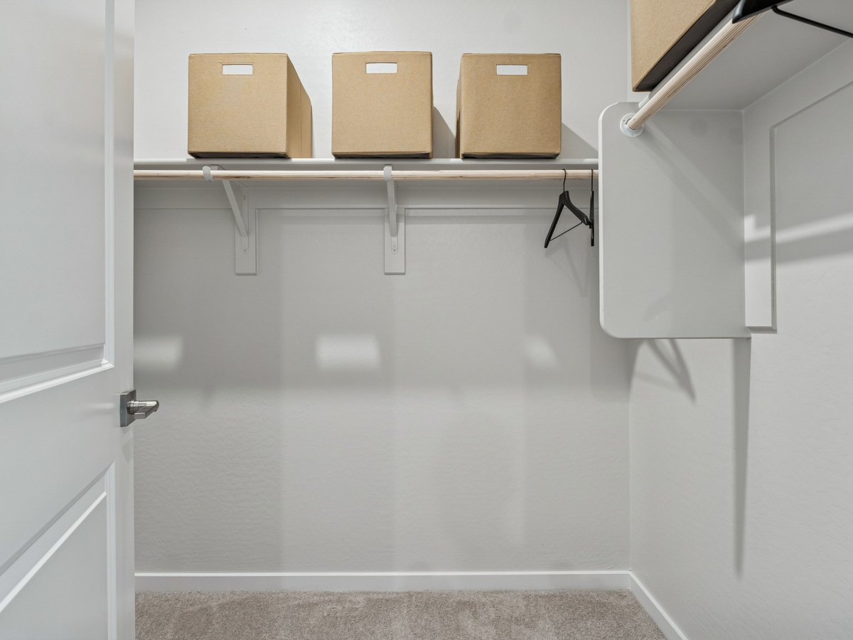 A shelf with boxes on it.