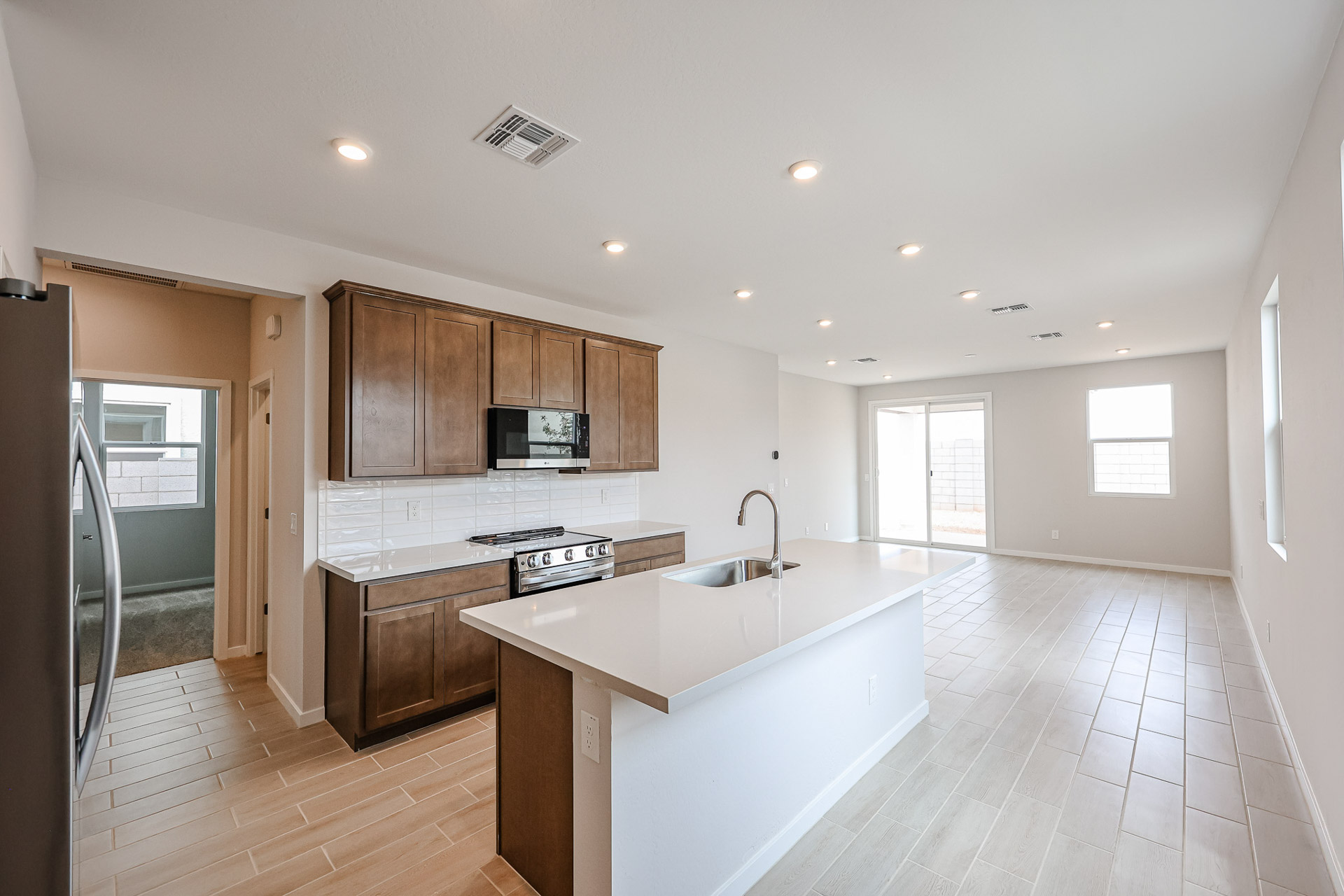A kitchen with wooden cabinets.
