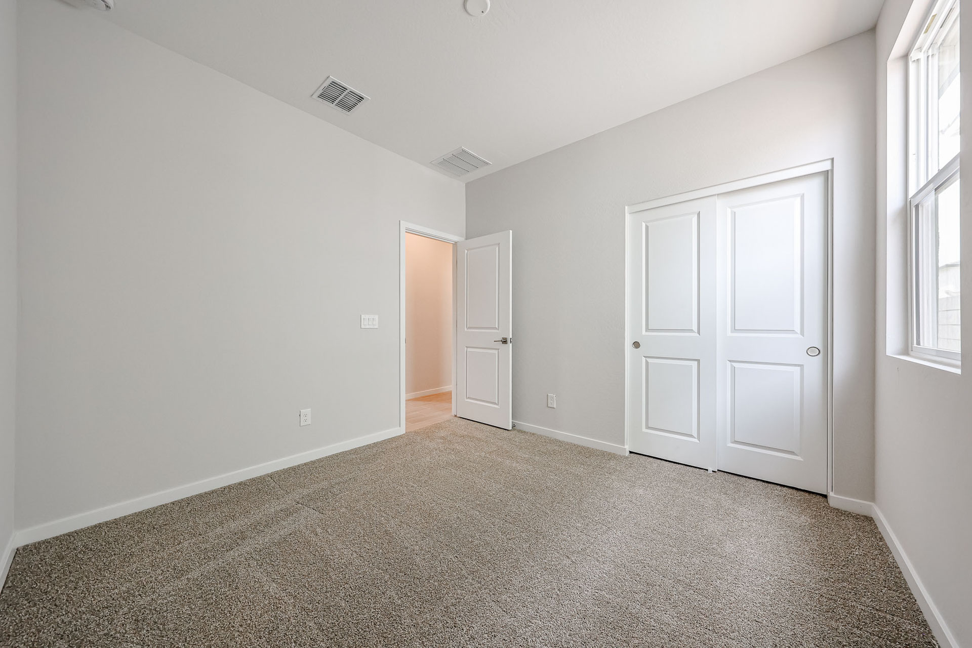 A room with white doors.
