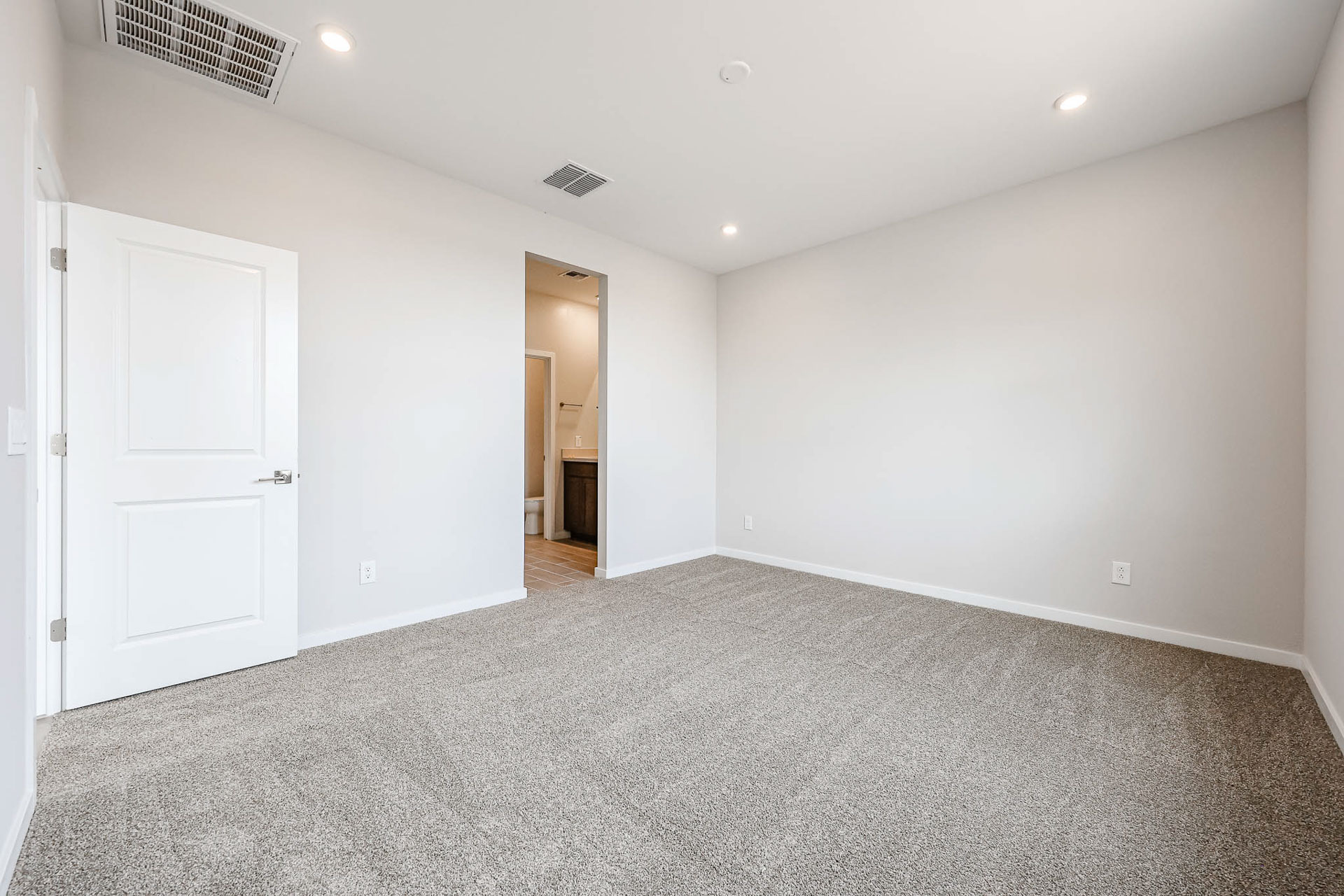 A hallway with white doors.