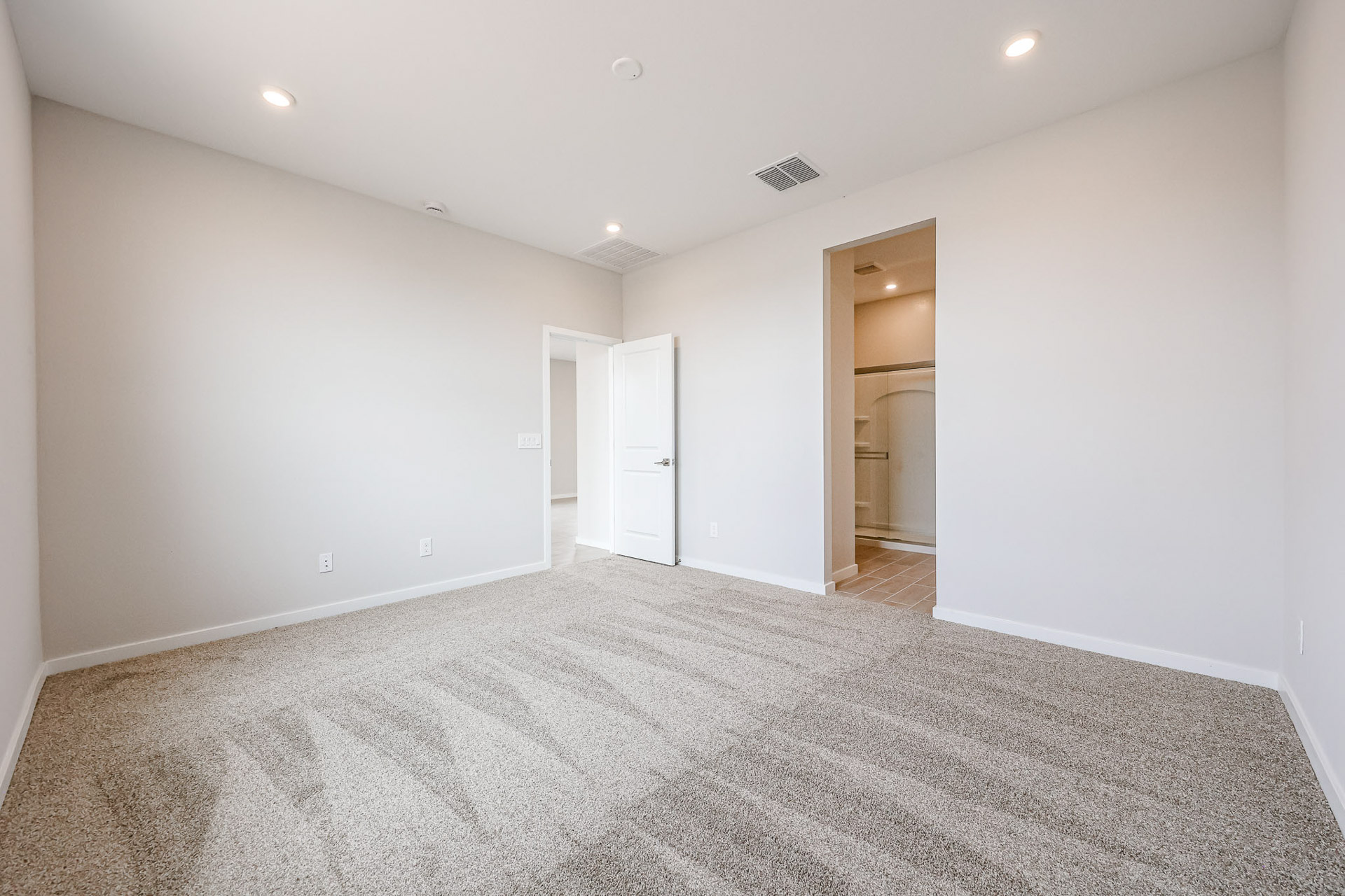 A hallway with white walls.