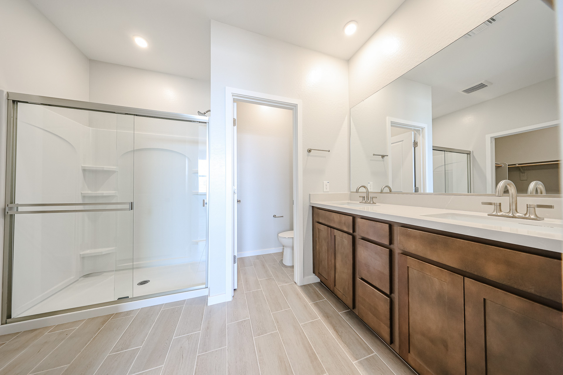 A bathroom with a glass shower.