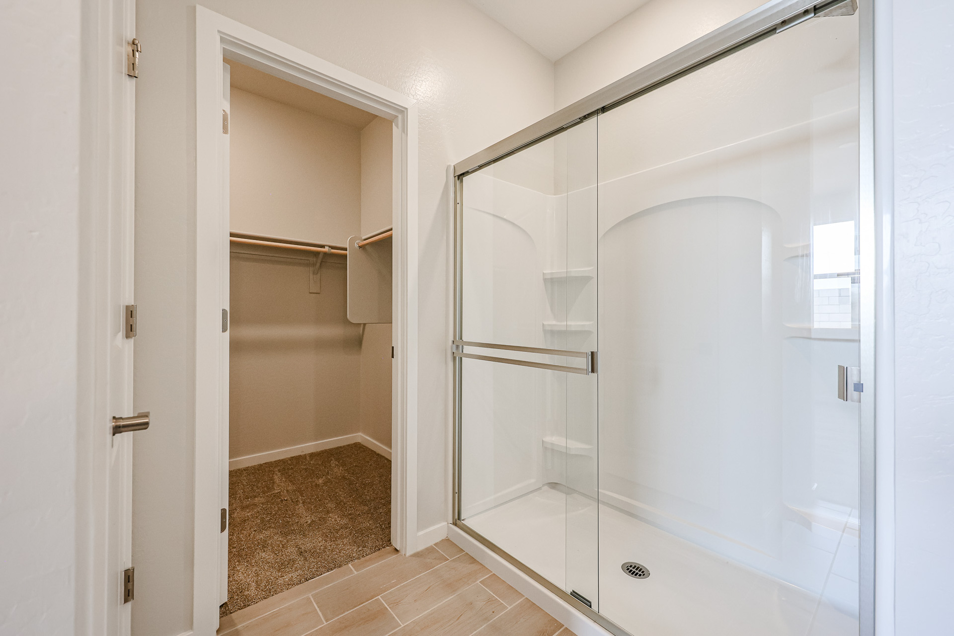 A bathroom with a glass shower.