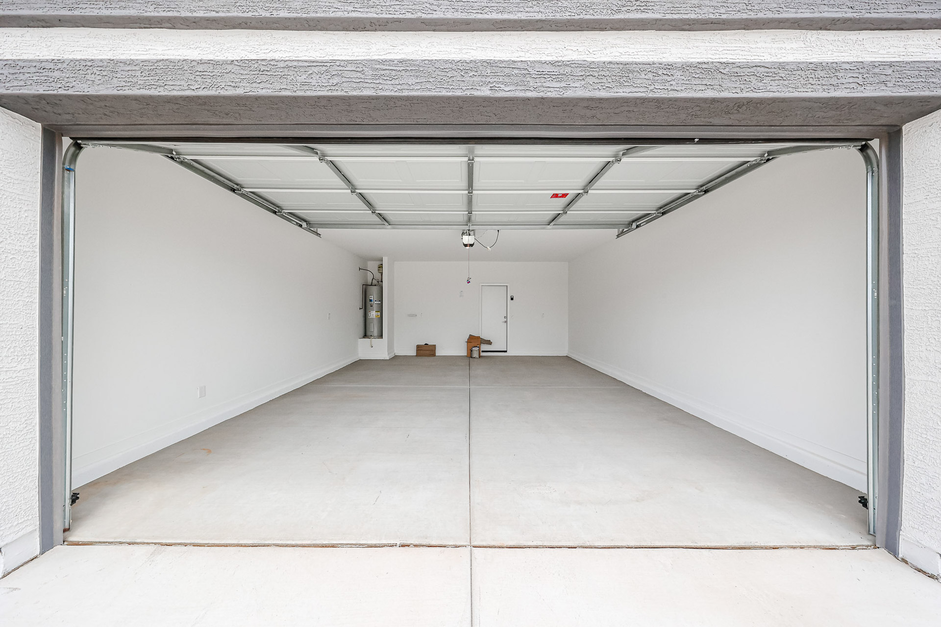 A hallway with white walls.