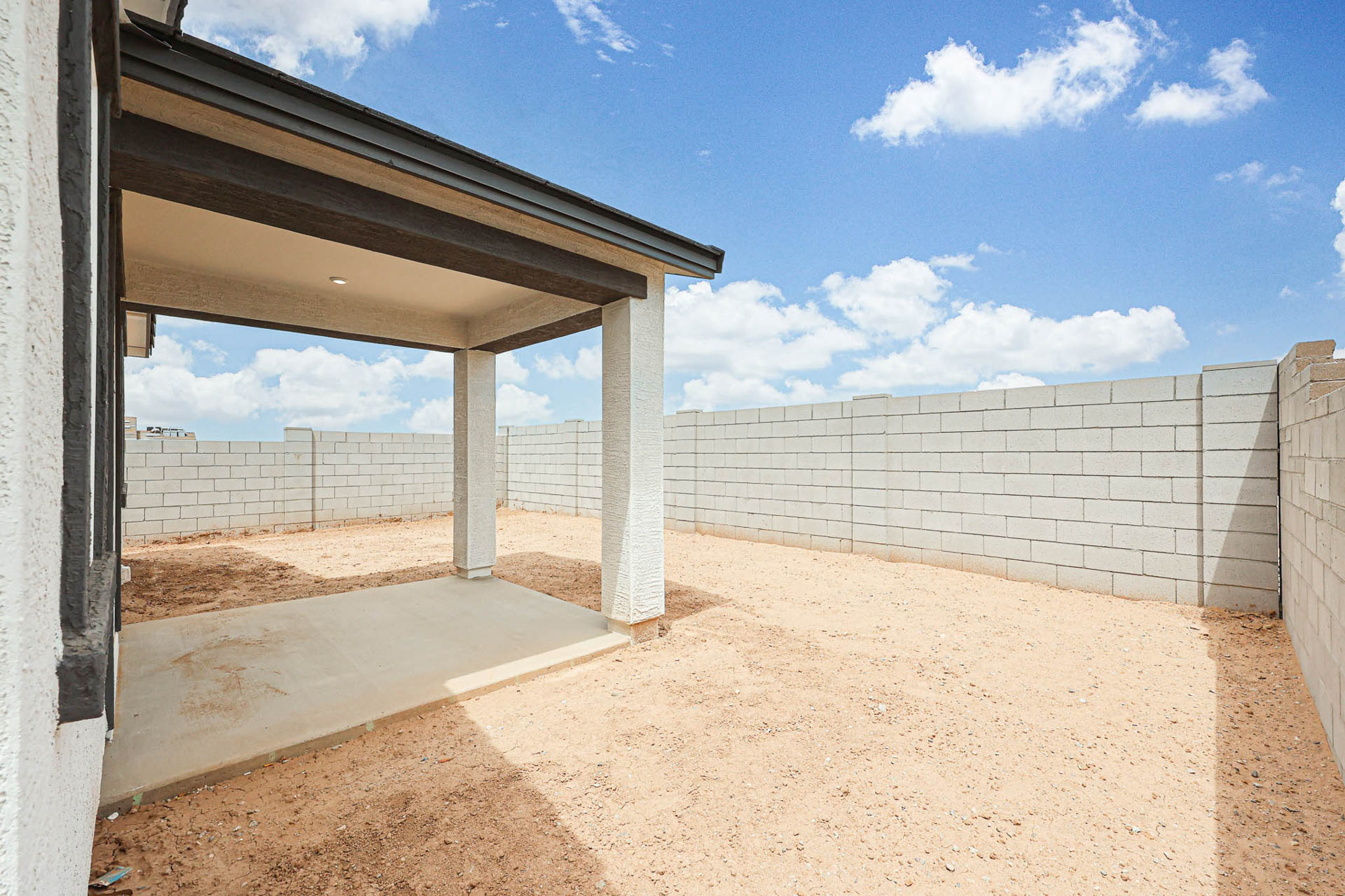 A concrete wall with a roof.