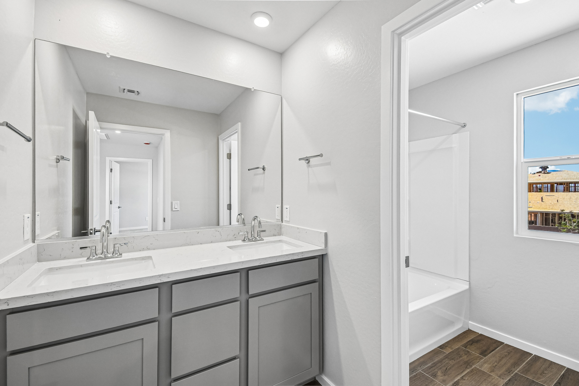 A bathroom with a sink and a mirror.