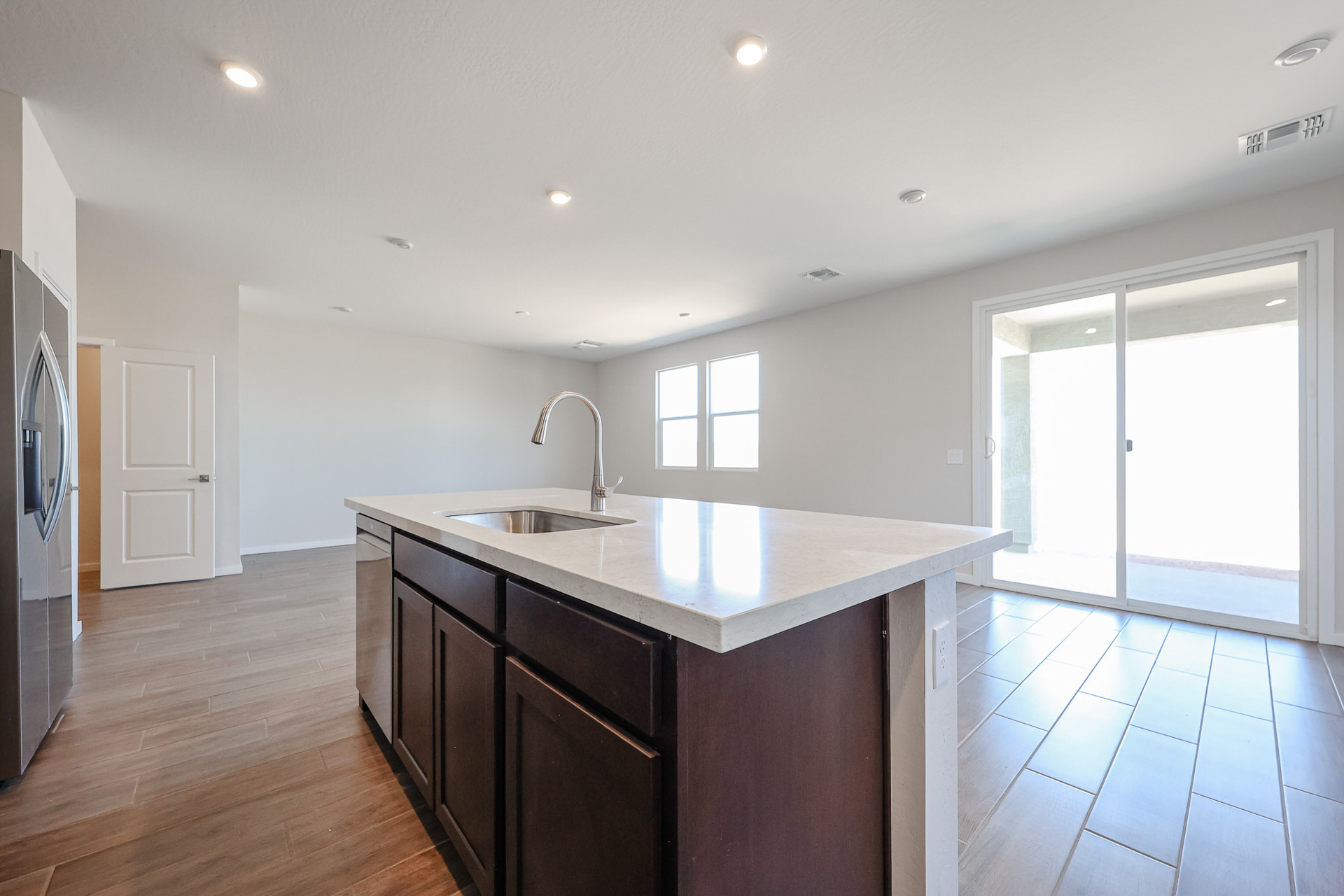 A kitchen with a marble countertop.