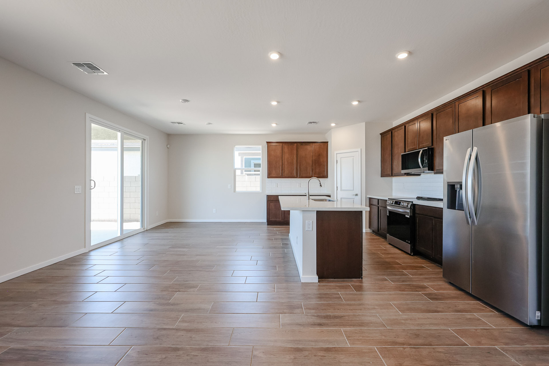 A large kitchen with wooden cabinets.