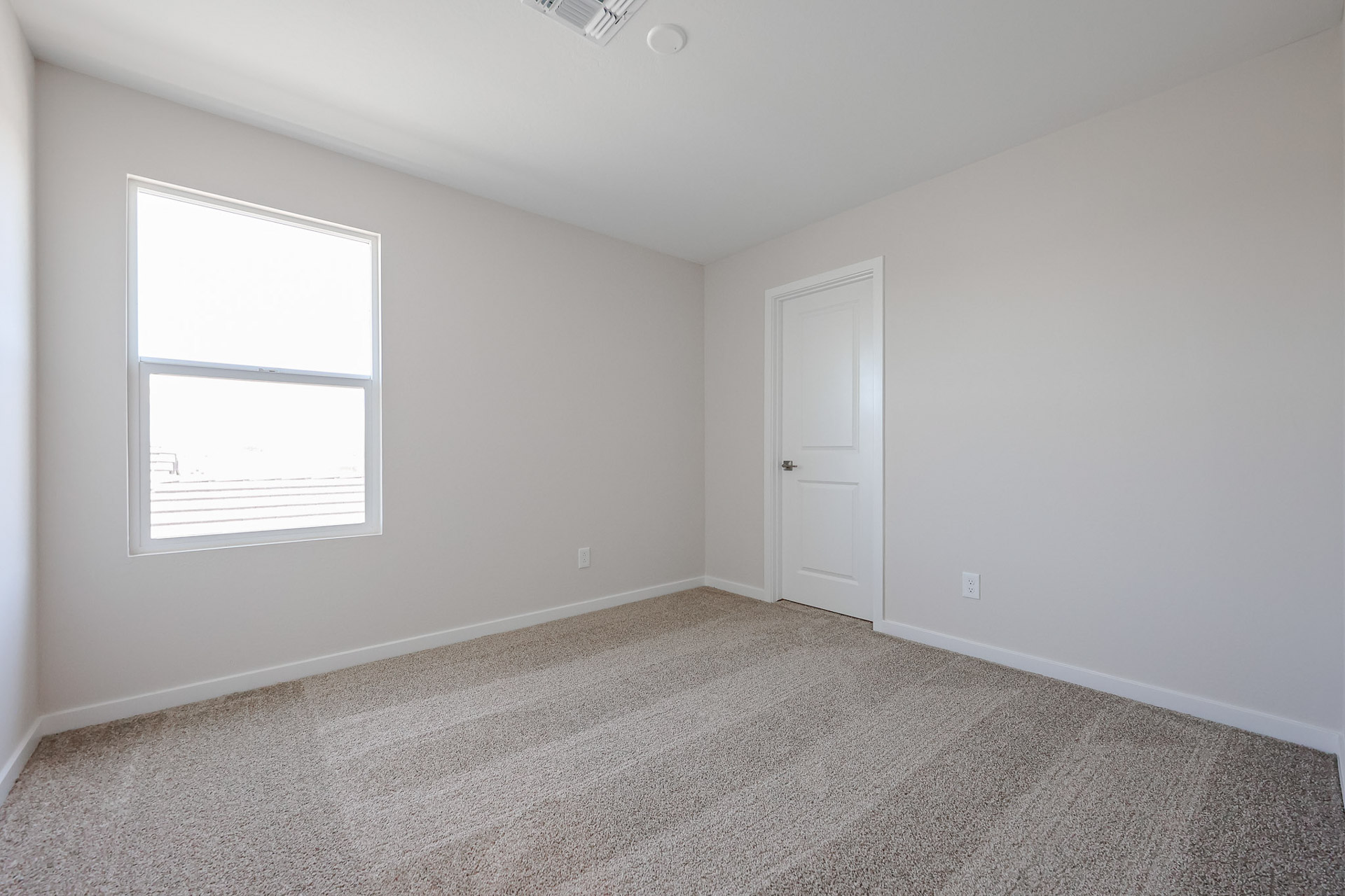 A room with a door and a window.