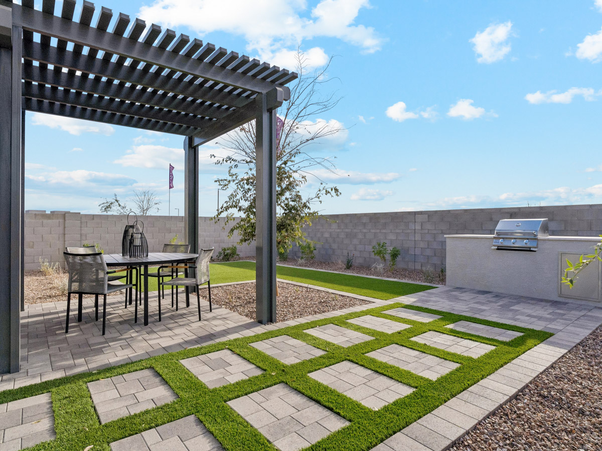 A patio with a table and chairs.