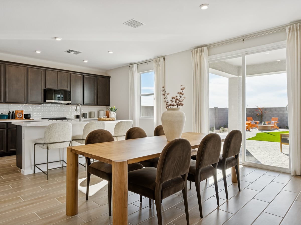 A kitchen with a dining table.