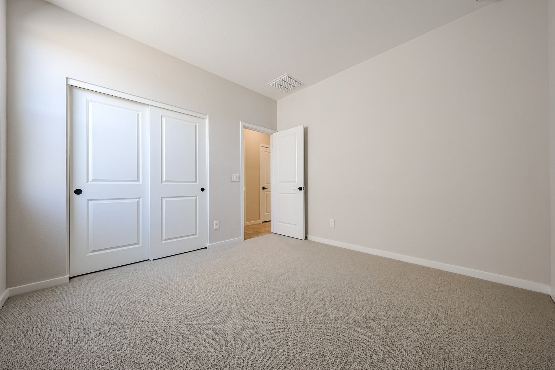 A room with white doors.