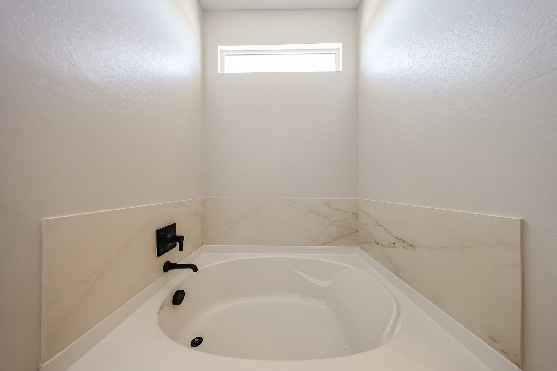 A white sink in a bathroom.