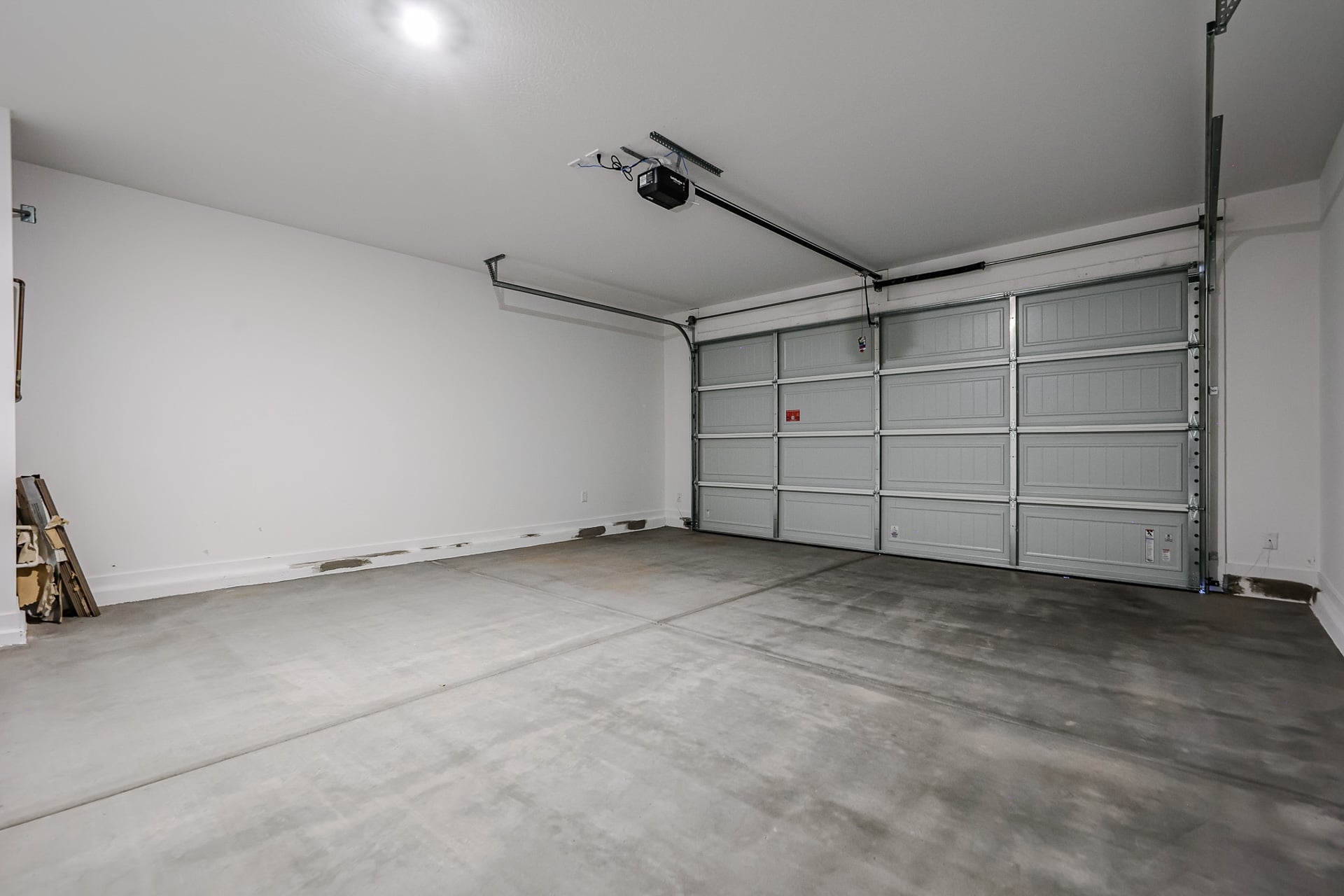 A room with a large metal door.