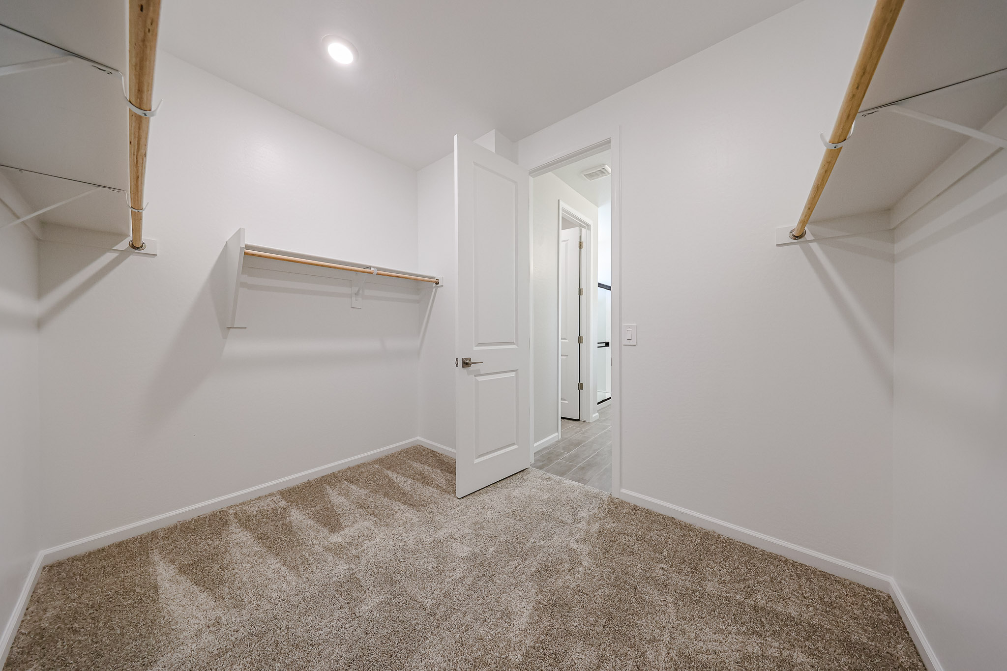 A hallway with white walls.