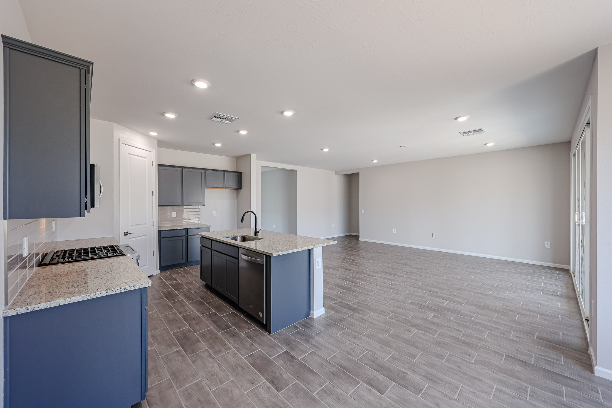 A kitchen with marble counters.