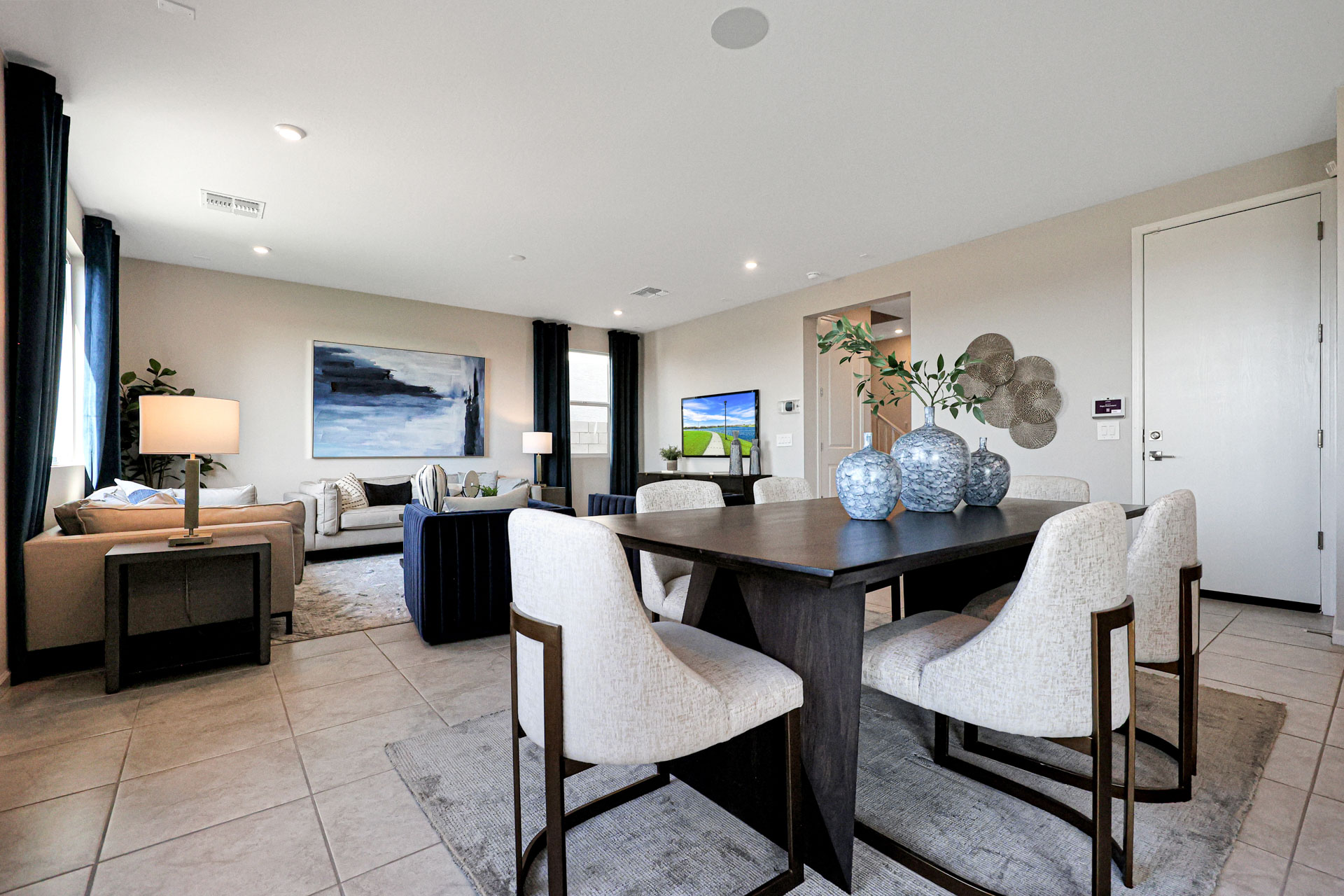 A room with a table and chairs.