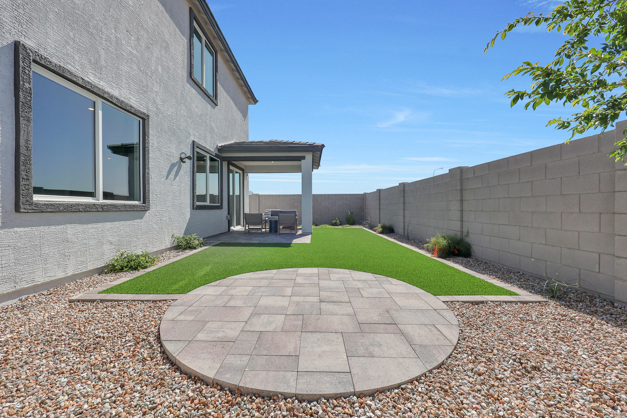 A courtyard with a stone circle in the middle of it.