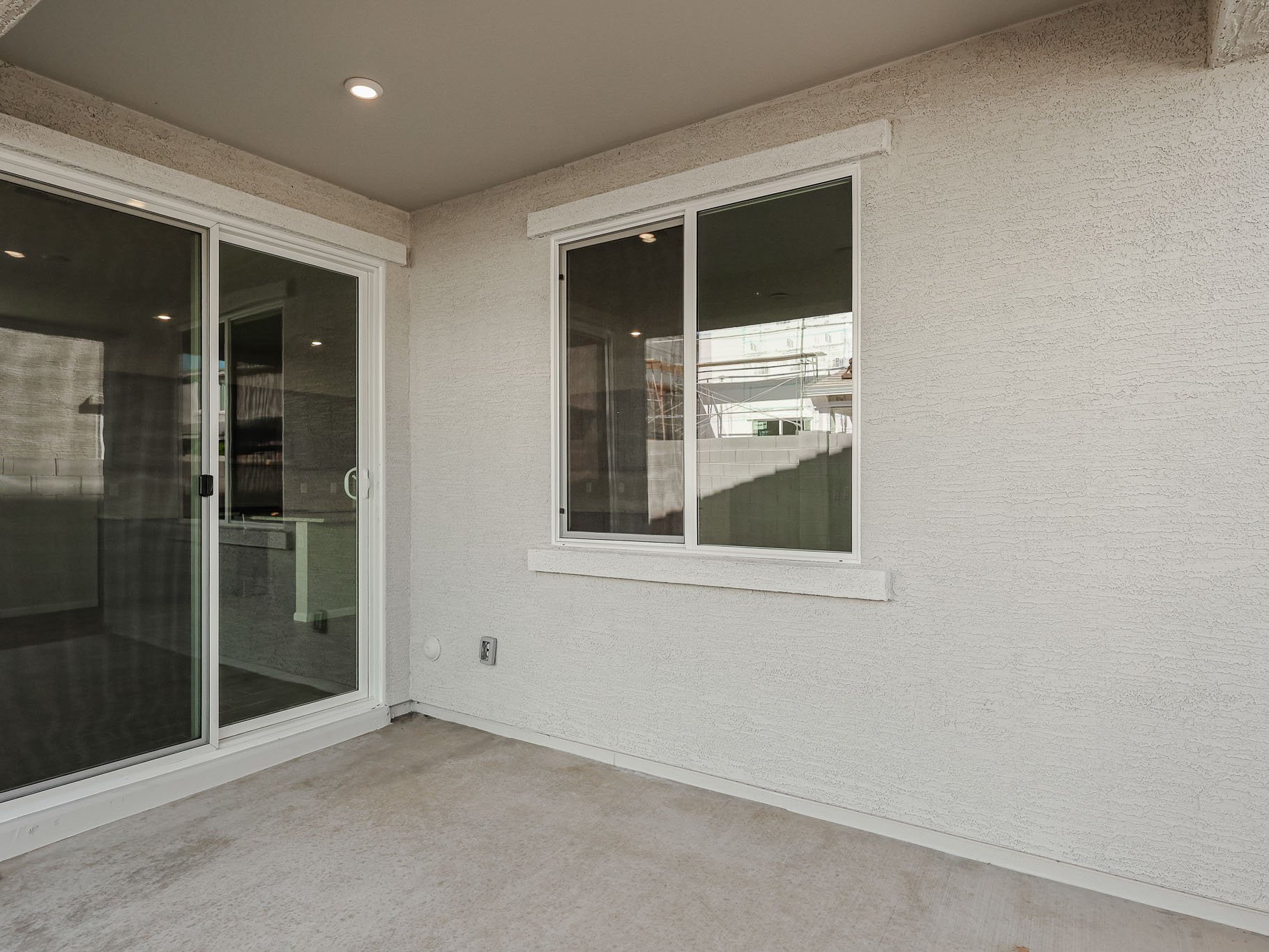 A room with a window and a door.