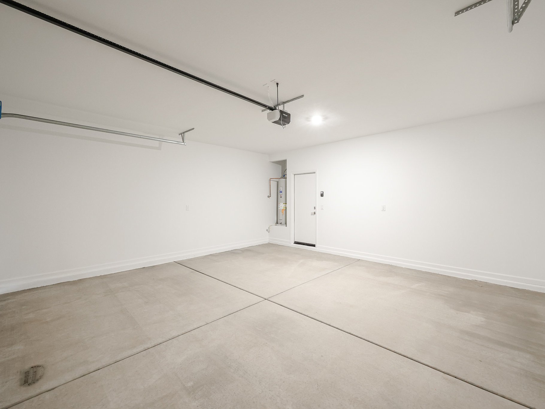 A hallway with white walls.