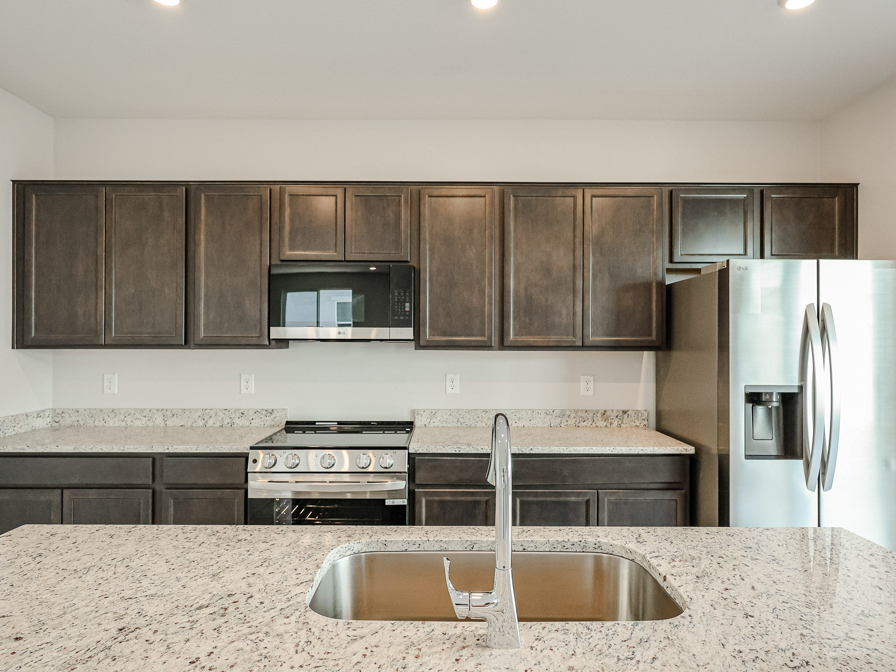 A kitchen with stainless steel appliances.