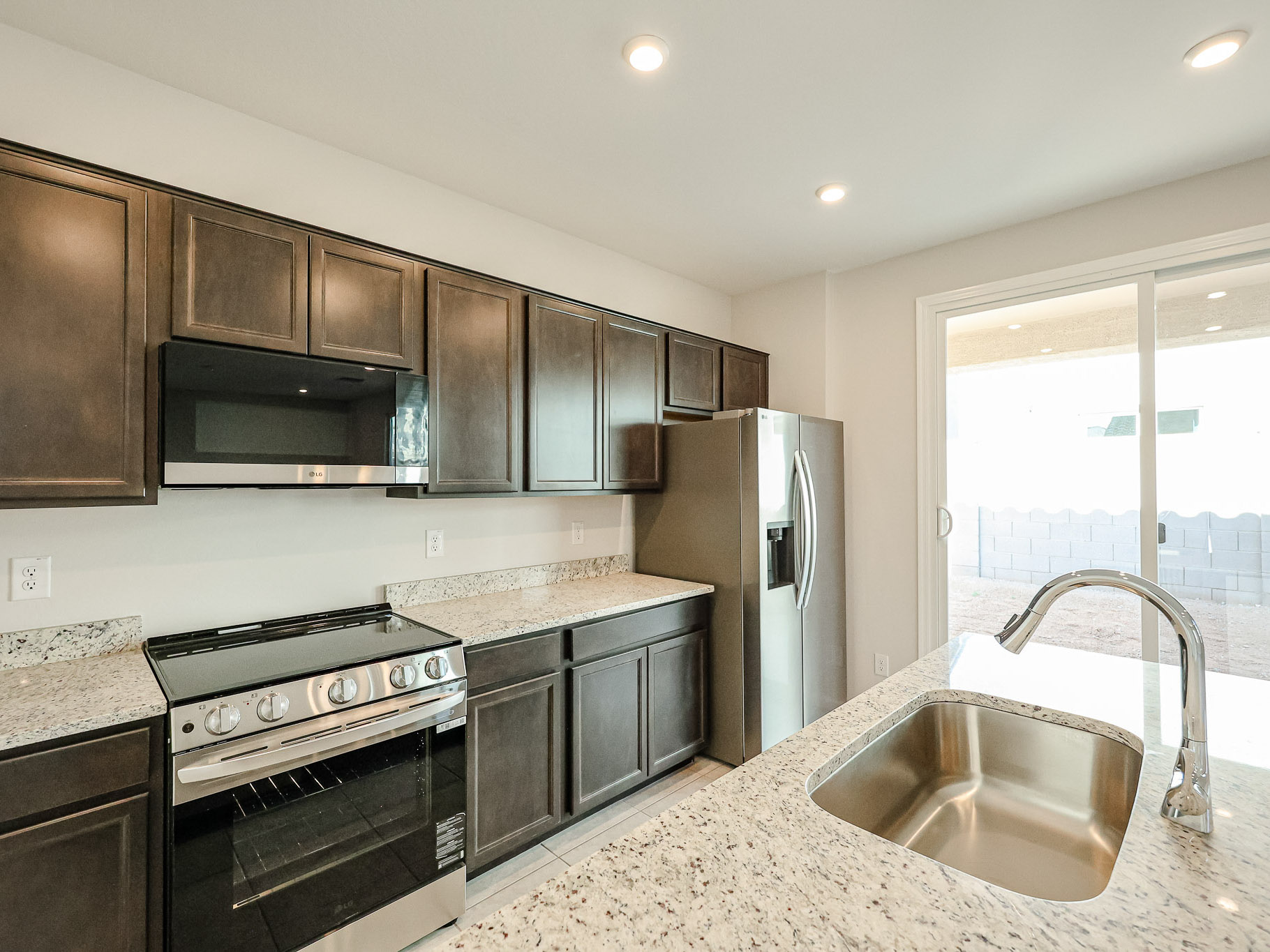 A kitchen with black appliances.