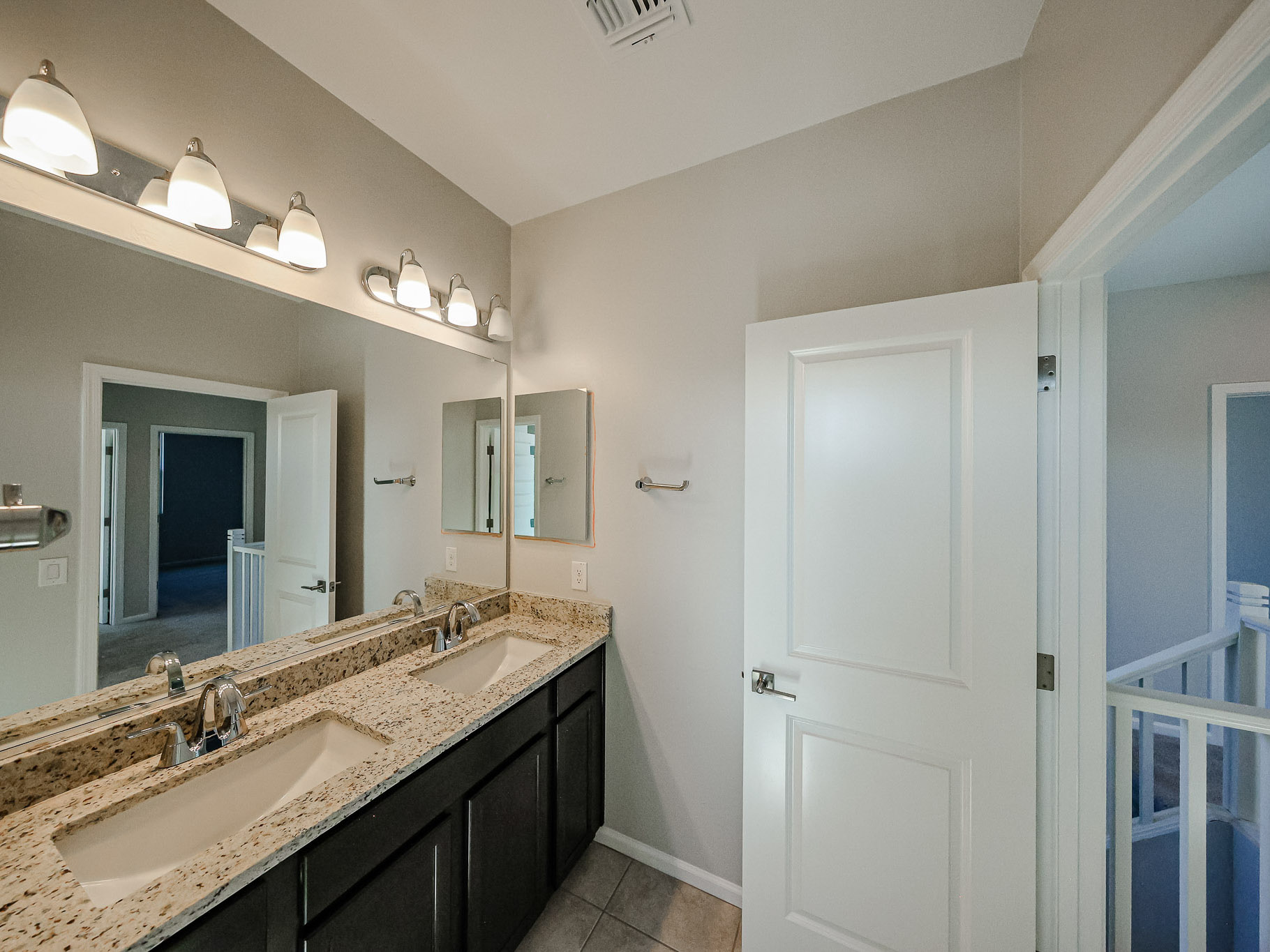 A bathroom with a marble countertop.