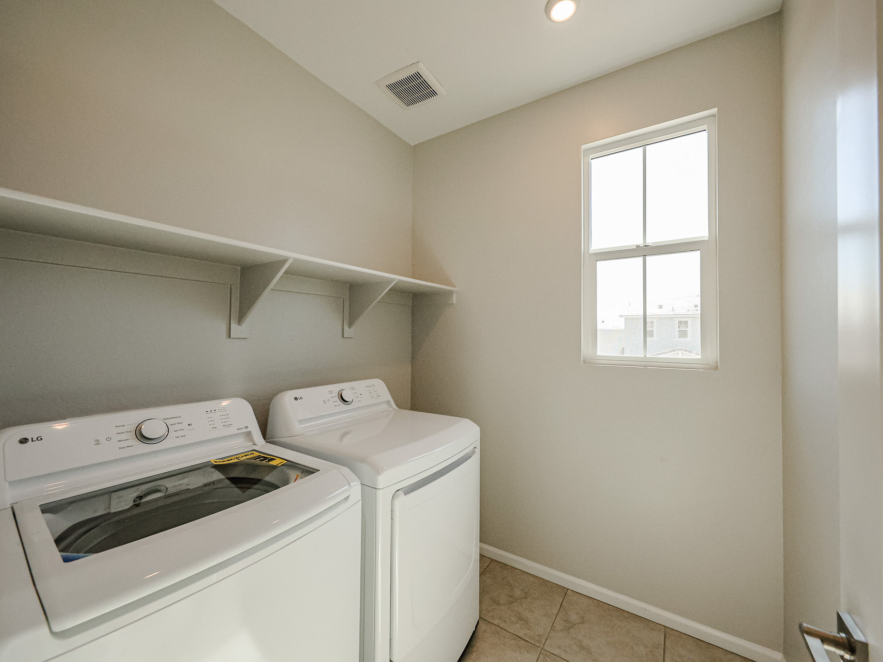 A laundry room with a washer and dryer.