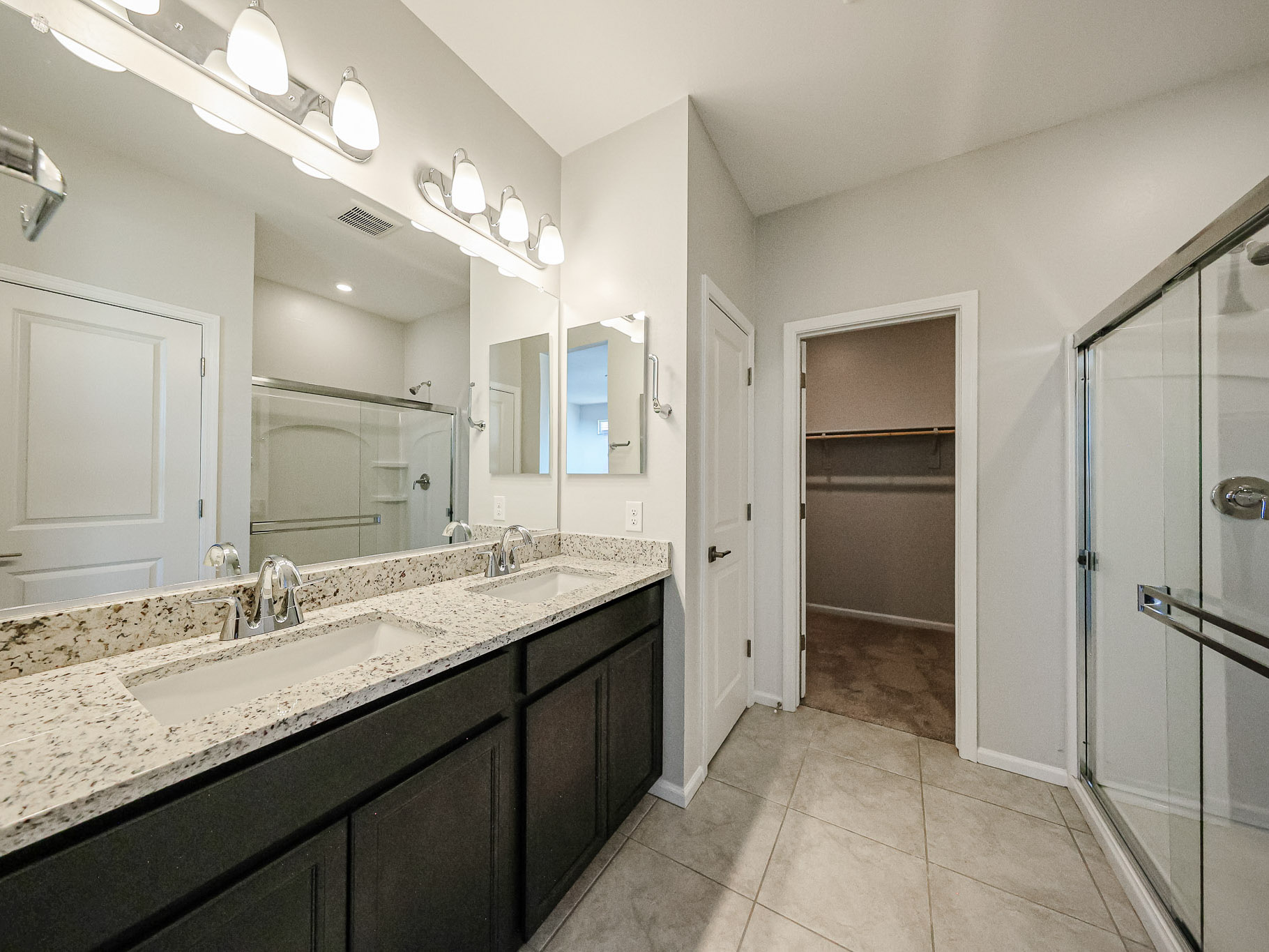 A bathroom with a marble countertop.