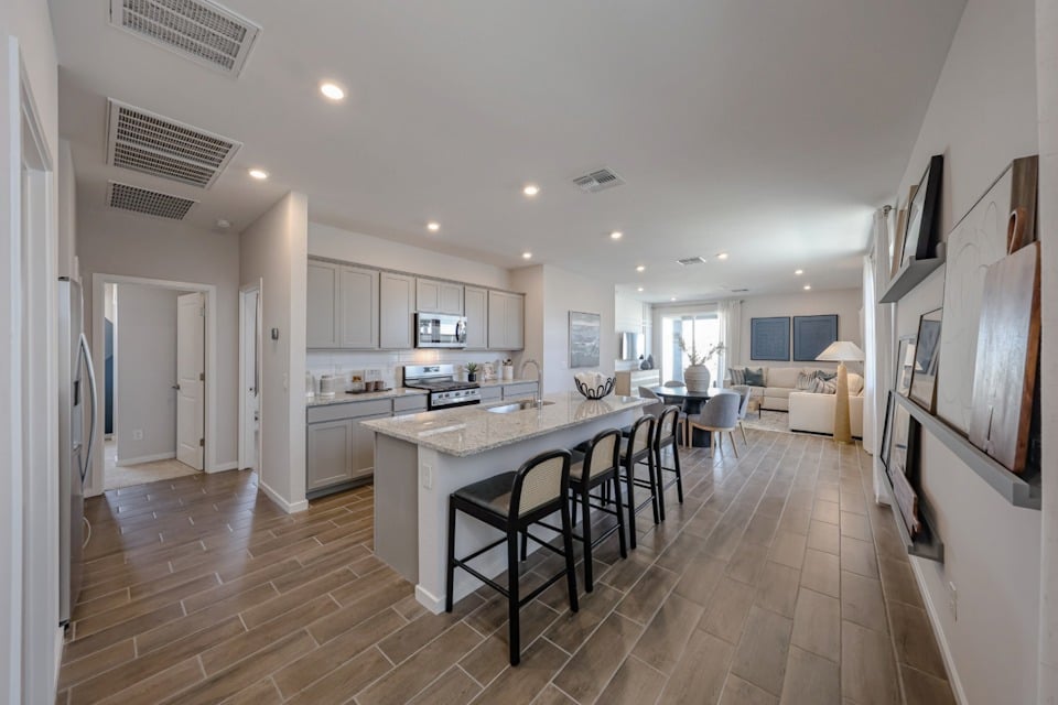 A kitchen with a dining table.