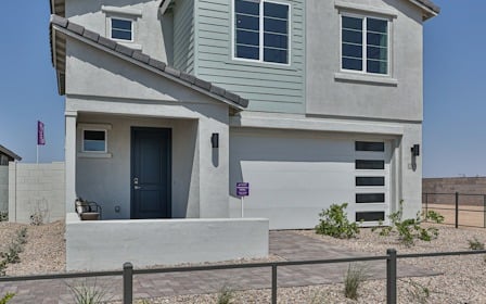 A house with a fence in front.