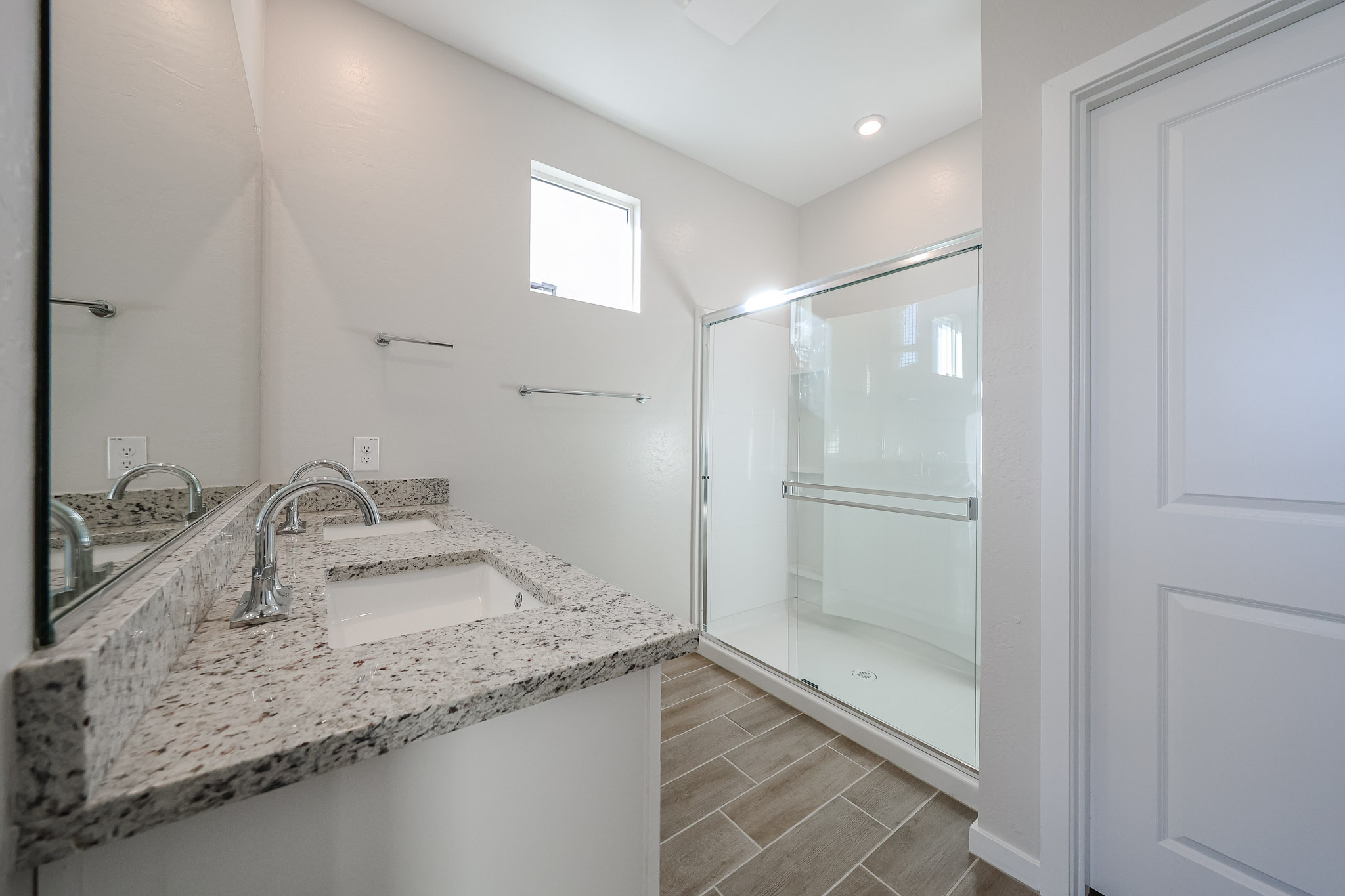 A bathroom with a glass shower.