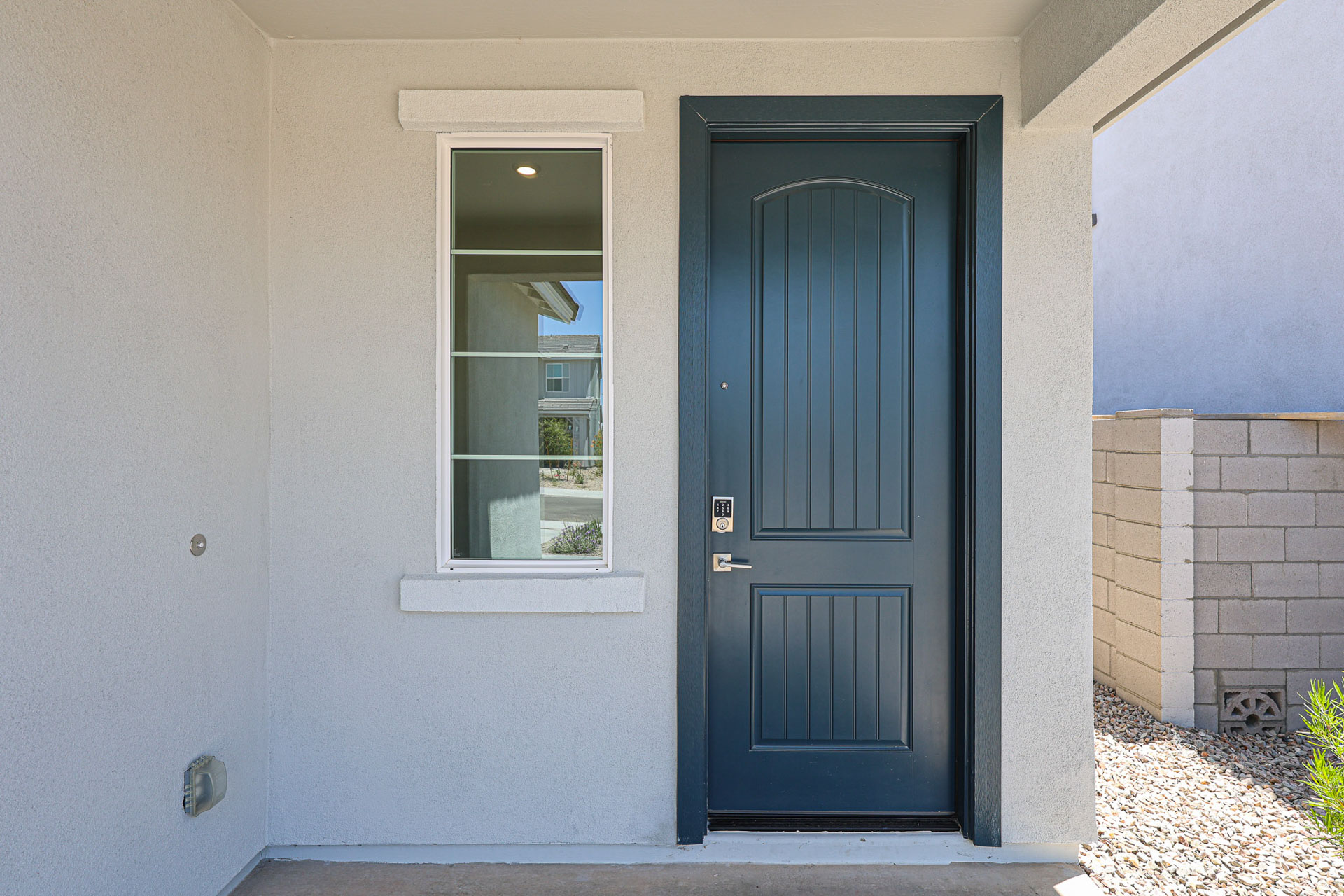 A blue door in a white building.