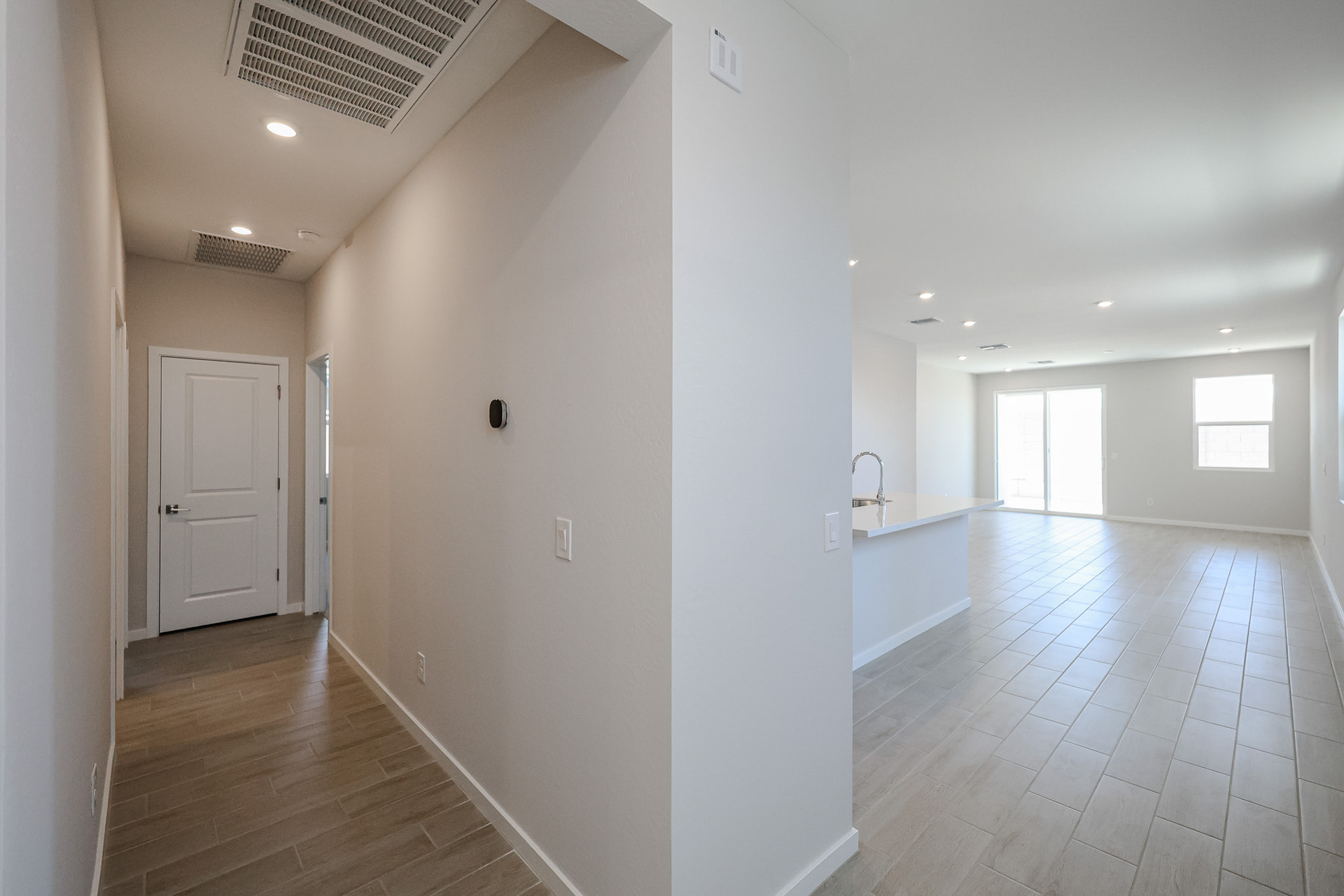 A bathroom with white walls.
