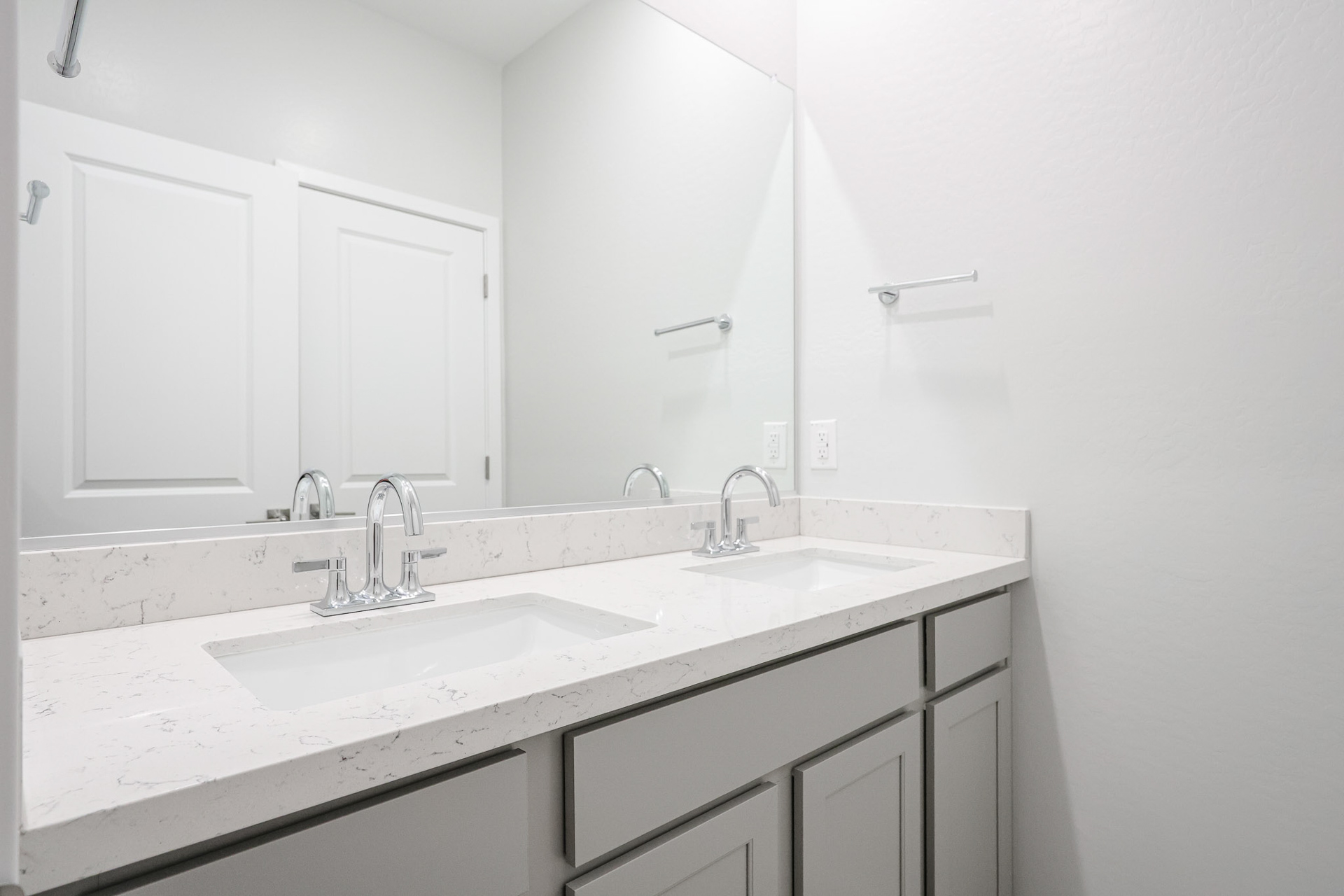 A couple of sinks in a bathroom.