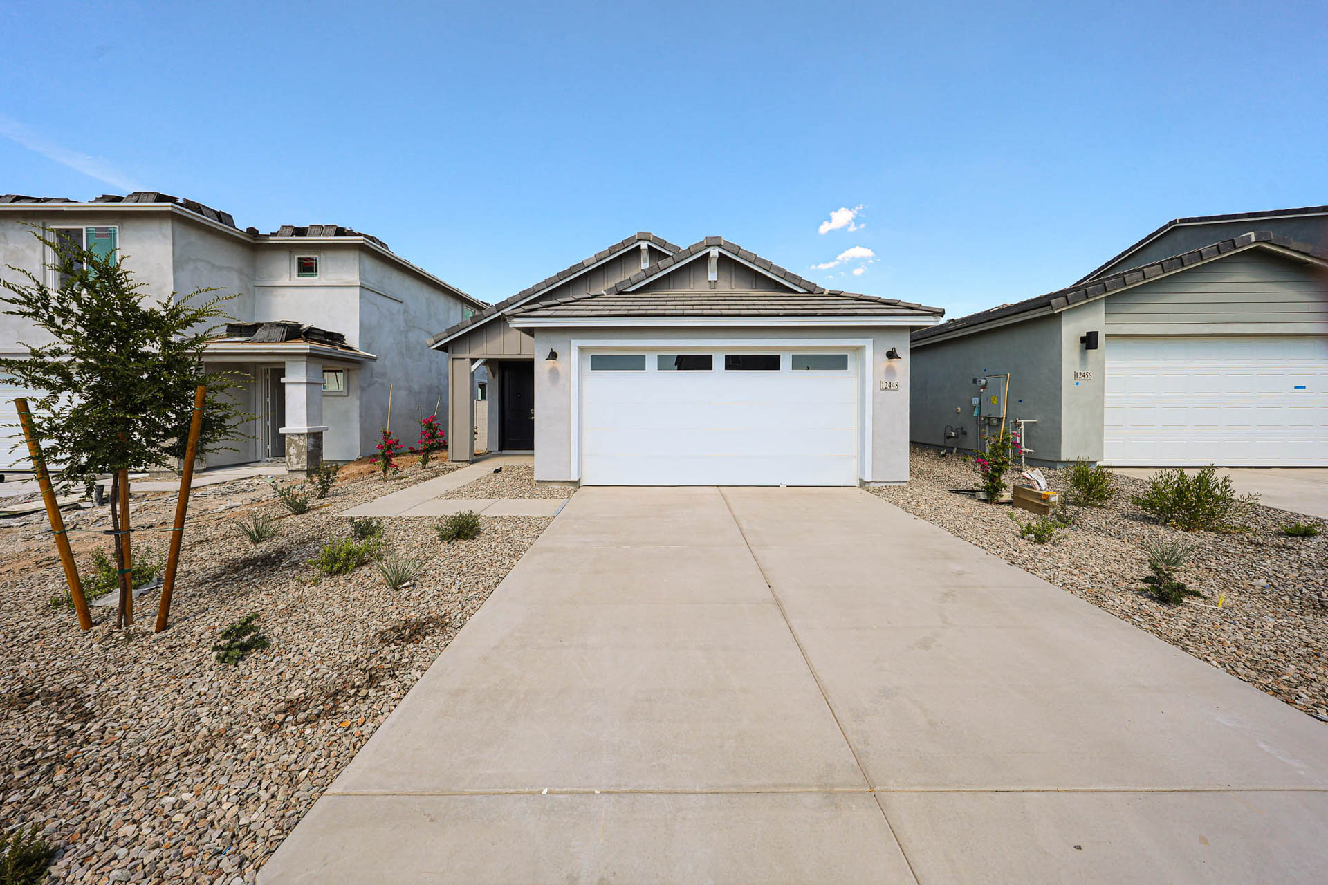 A driveway leading to a house.