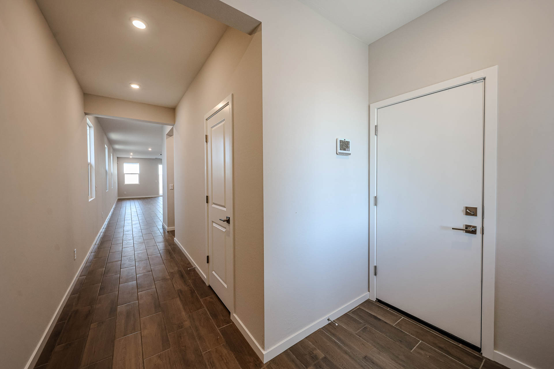 A hallway with white doors.